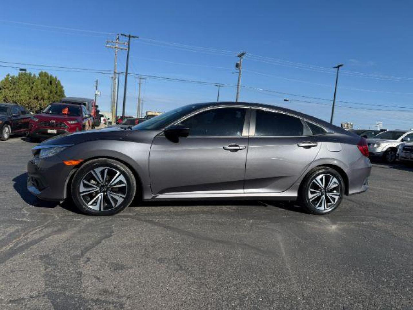 2017 GRAY /Black Honda Civic (19XFC1F35HE) with an 15L I-4 gasoline direct injection engine, Automatic transmission, located at 1175 N Woodruff Ave, Idaho Falls, ID, 83401, 43.506901, -111.999657 - At Timberline Auto, finding a great deal on your next vehicle is always easy! Our experienced sales staff's goal is to help find you the right vehicle at the right price! Our knowledgeable finance department has options for almost any credit score. We offer extended service contract options to prote - Photo#22