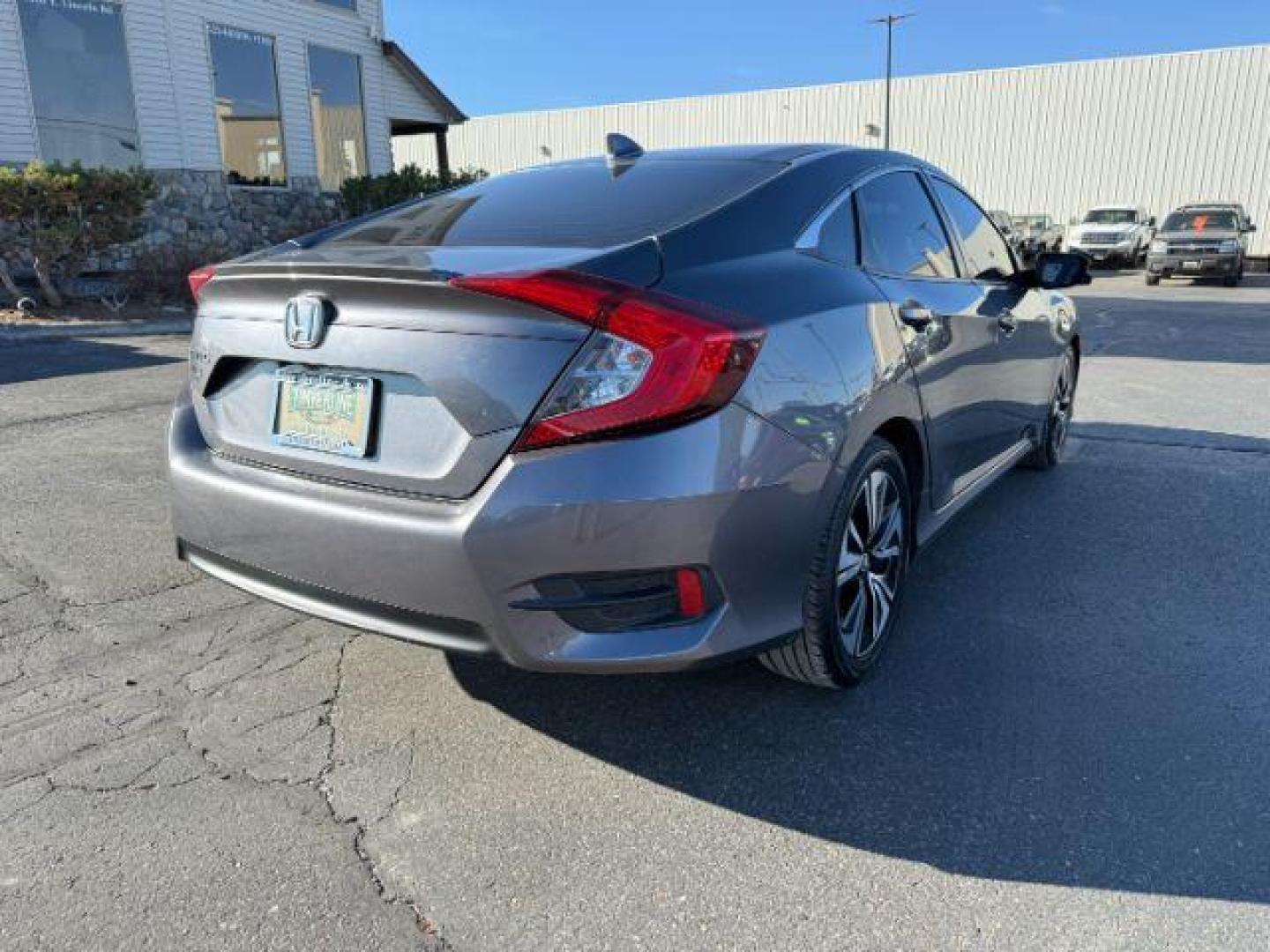 2017 GRAY /Black Honda Civic (19XFC1F35HE) with an 15L I-4 gasoline direct injection engine, Automatic transmission, located at 1175 N Woodruff Ave, Idaho Falls, ID, 83401, 43.506901, -111.999657 - At Timberline Auto, finding a great deal on your next vehicle is always easy! Our experienced sales staff's goal is to help find you the right vehicle at the right price! Our knowledgeable finance department has options for almost any credit score. We offer extended service contract options to prote - Photo#26