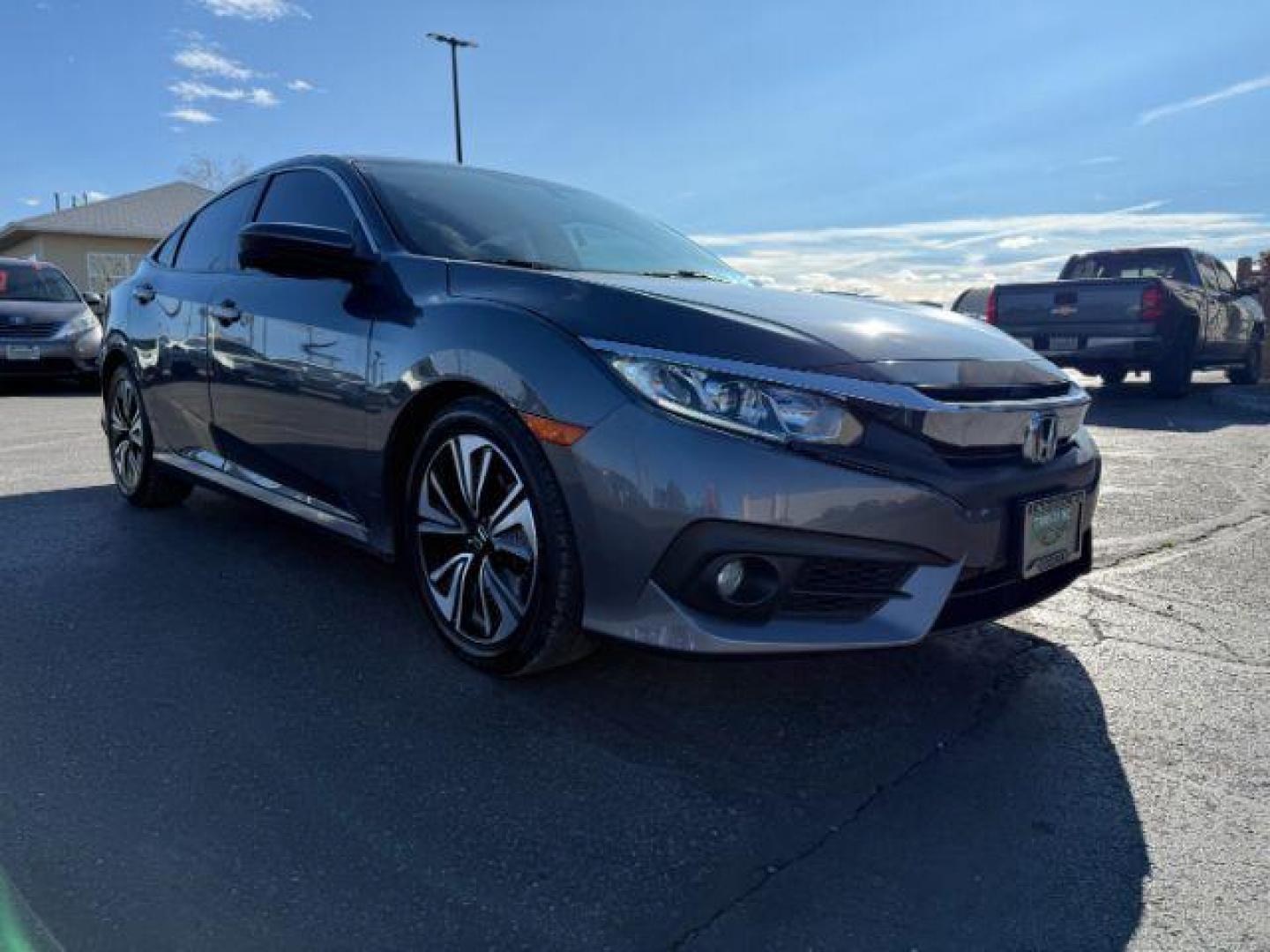 2017 GRAY /Black Honda Civic (19XFC1F35HE) with an 15L I-4 gasoline direct injection engine, Automatic transmission, located at 1175 N Woodruff Ave, Idaho Falls, ID, 83401, 43.506901, -111.999657 - At Timberline Auto, finding a great deal on your next vehicle is always easy! Our experienced sales staff's goal is to help find you the right vehicle at the right price! Our knowledgeable finance department has options for almost any credit score. We offer extended service contract options to prote - Photo#28