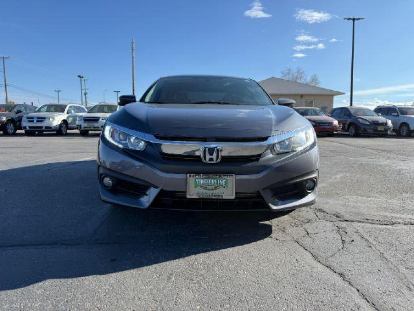 2017 GRAY /Black Honda Civic (19XFC1F35HE) with an 15L I-4 gasoline direct injection engine, Automatic transmission, located at 1175 N Woodruff Ave, Idaho Falls, ID, 83401, 43.506901, -111.999657 - At Timberline Auto, finding a great deal on your next vehicle is always easy! Our experienced sales staff's goal is to help find you the right vehicle at the right price! Our knowledgeable finance department has options for almost any credit score. We offer extended service contract options to prote - Photo#29