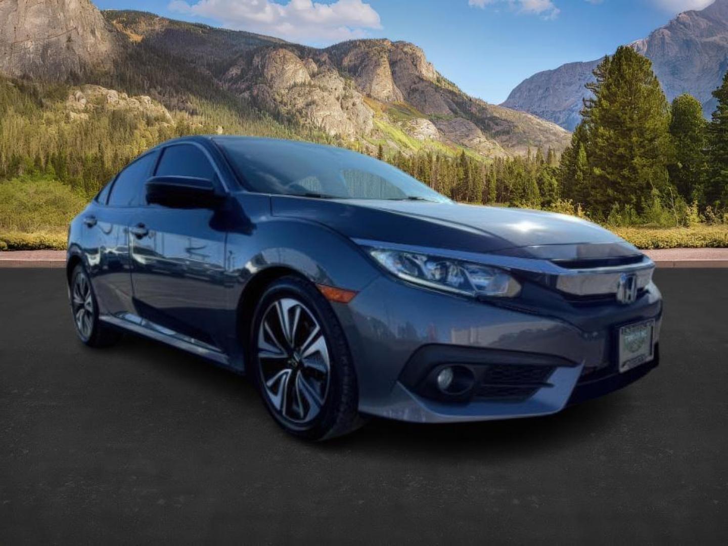 2017 GRAY /Black Honda Civic (19XFC1F35HE) with an 15L I-4 gasoline direct injection engine, Automatic transmission, located at 1175 N Woodruff Ave, Idaho Falls, ID, 83401, 43.506901, -111.999657 - At Timberline Auto, finding a great deal on your next vehicle is always easy! Our experienced sales staff's goal is to help find you the right vehicle at the right price! Our knowledgeable finance department has options for almost any credit score. We offer extended service contract options to prote - Photo#7