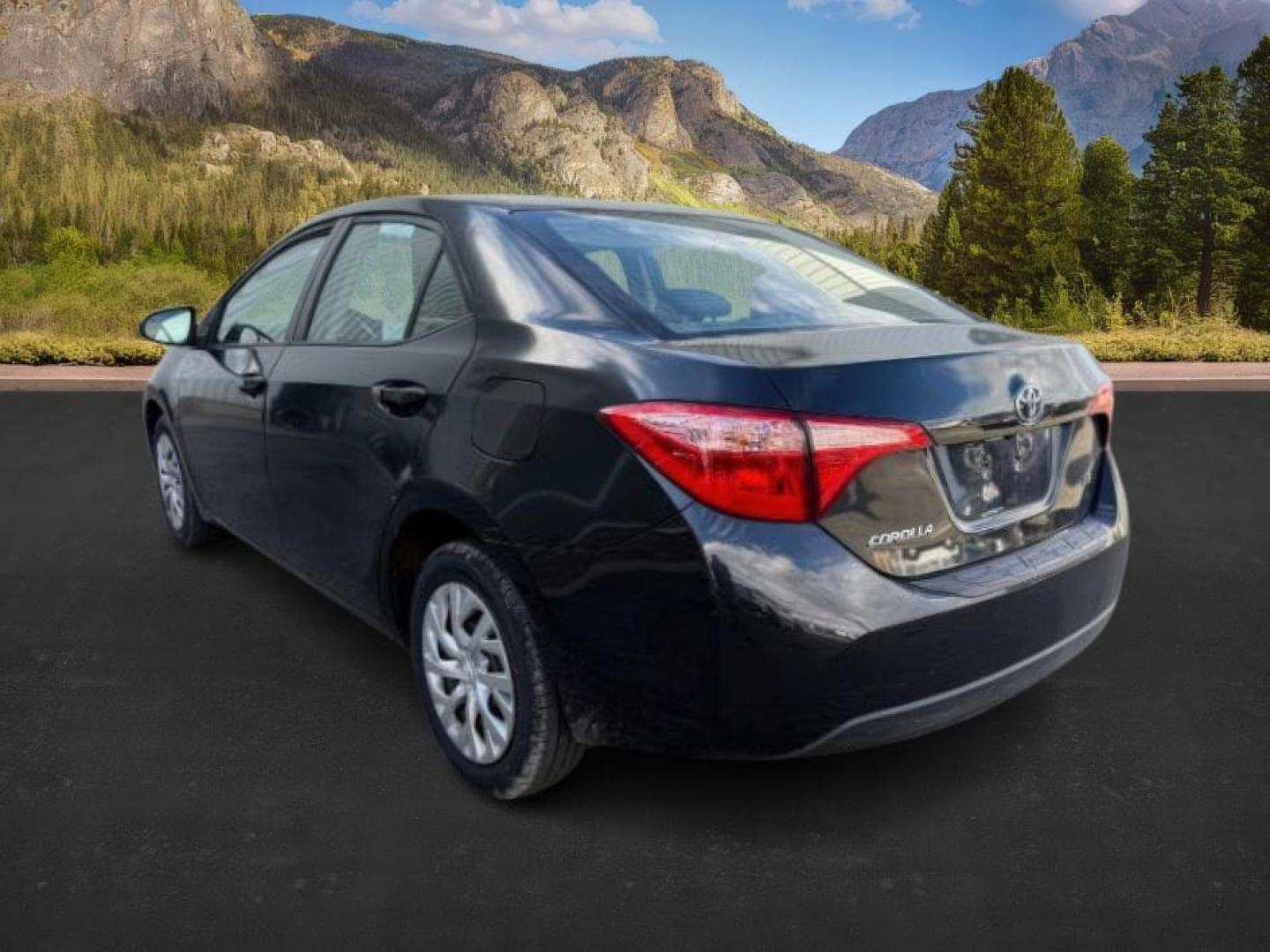 2018 BLACK /Steel Gray Toyota Corolla (5YFBURHE8JP) with an 18L I-4 DOHC engine, Automatic transmission, located at 1175 N Woodruff Ave, Idaho Falls, ID, 83401, 43.506901, -111.999657 - At Timberline Auto, finding a great deal on your next vehicle is always easy! Our experienced sales staff's goal is to help find you the right vehicle at the right price! Our knowledgeable finance department has options for almost any credit score. We offer extended service contract options to prote - Photo#2