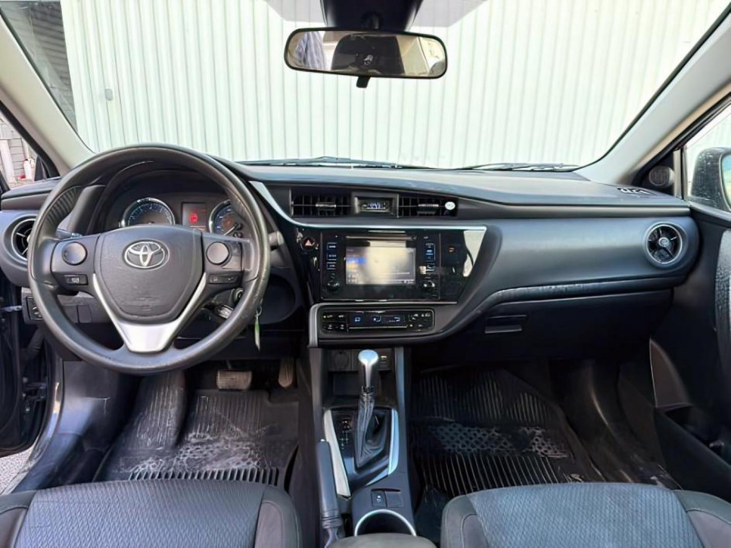 2018 BLACK /Steel Gray Toyota Corolla (5YFBURHE8JP) with an 18L I-4 DOHC engine, Automatic transmission, located at 1175 N Woodruff Ave, Idaho Falls, ID, 83401, 43.506901, -111.999657 - At Timberline Auto, finding a great deal on your next vehicle is always easy! Our experienced sales staff's goal is to help find you the right vehicle at the right price! Our knowledgeable finance department has options for almost any credit score. We offer extended service contract options to prote - Photo#14
