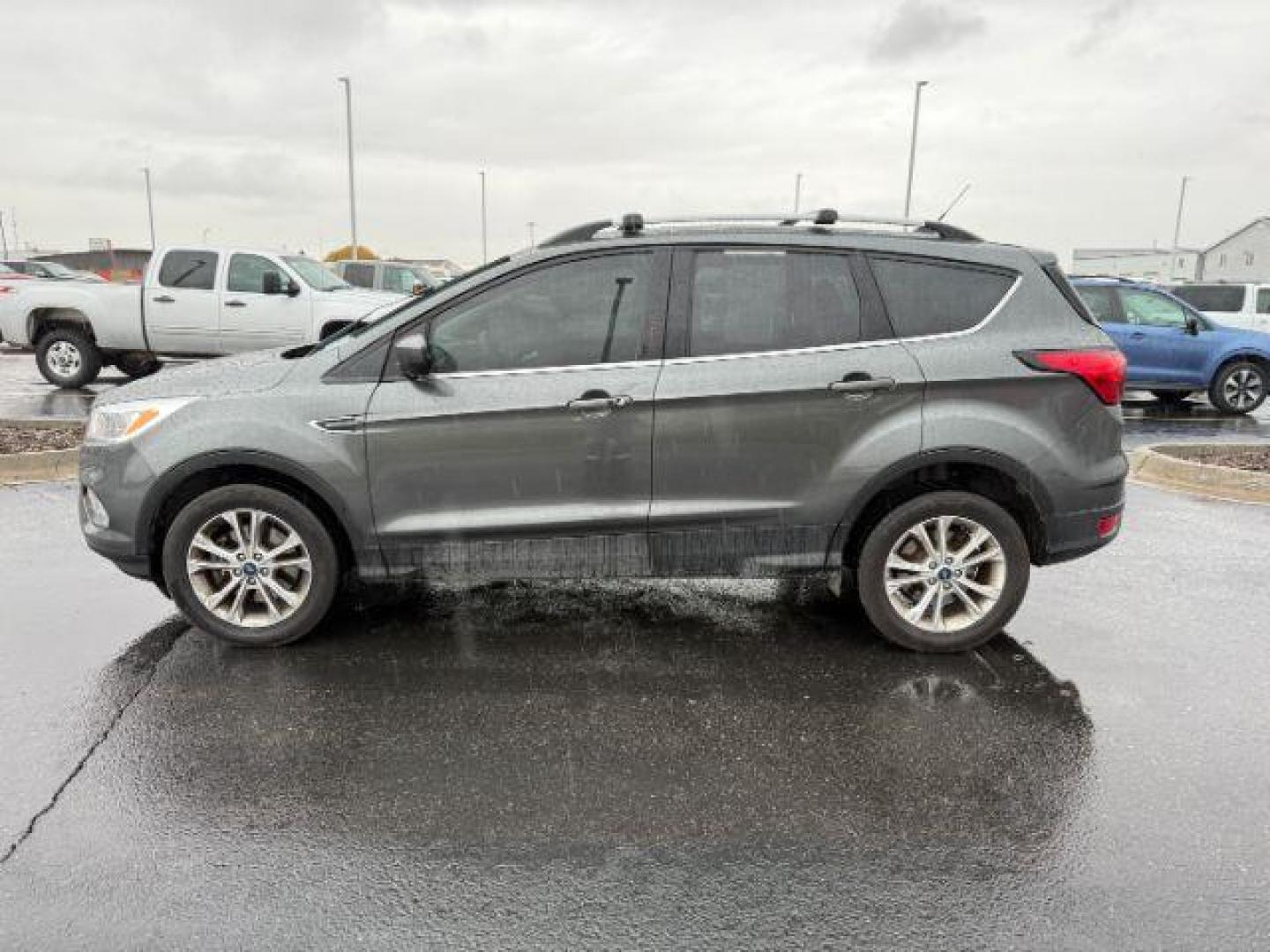 2019 GRAY /Chromite Gray/Charcoal Black Ford Escape (1FMCU9GD0KU) with an EcoBoost 15L I-4 gasoline direct injection engine, Automatic transmission, located at 1175 N Woodruff Ave, Idaho Falls, ID, 83401, 43.506901, -111.999657 - Photo#1