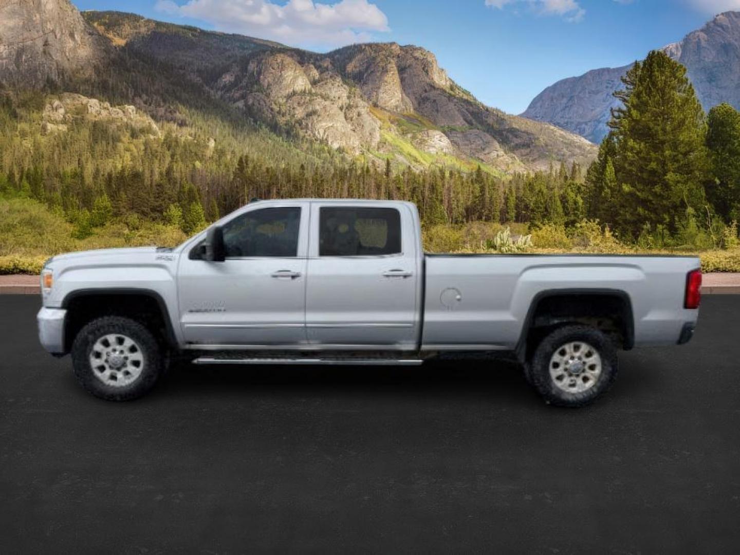 2015 SILVER /Jet Black GMC Sierra 2500HD (1GT12YE8XFF) with an 66L DURAMAX engine, Automatic transmission, located at 1175 N Woodruff Ave, Idaho Falls, ID, 83401, 43.506901, -111.999657 - At Timberline Auto, finding a great deal on your next vehicle is always easy! Our experienced sales staff's goal is to help find you the right vehicle at the right price! Our knowledgeable finance department has options for almost any credit score. We offer extended service contract options to prote - Photo#0