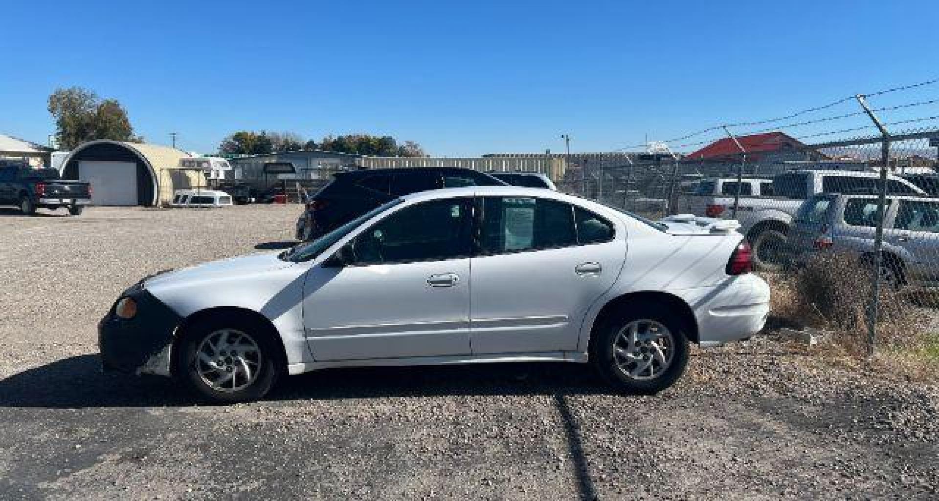2003 Summit White /Dark Pewter Pontiac Grand Am (1G2NF52E93C) with an Ecotec 22L I-4 DOHC engine, Automatic transmission, located at 1175 N Woodruff Ave, Idaho Falls, ID, 83401, 43.506901, -111.999657 - At Timberline Auto, finding a great deal on your next vehicle is always easy! Our experienced sales staff's goal is to help find you the right vehicle at the right price! Our knowledgeable finance department has options for almost any credit score. We offer extended service contract options to prote - Photo#1