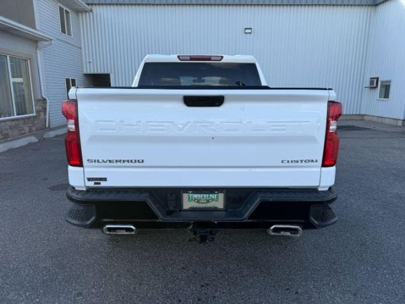 2021 Summit White /Jet Black Chevrolet Silverado Custom Trail Boss (3GCPYCEF3MG) with an V8, 5.3L engine, 6-speed automatic transmission, located at 1175 N Woodruff Ave, Idaho Falls, ID, 83401, 43.506901, -111.999657 - <b>Vehicle Details</b><br>Built for hard work, weekend adventures, and everything in between, this pre-owned 2021 Chevrolet Silverado 1500 Trail Boss Custom delivers the bold capability truck shoppers want. Equipped with 4WD and a powerful V8, 5.3L Gasoline engine, this Chevrolet Silverado is ready- Photo#3