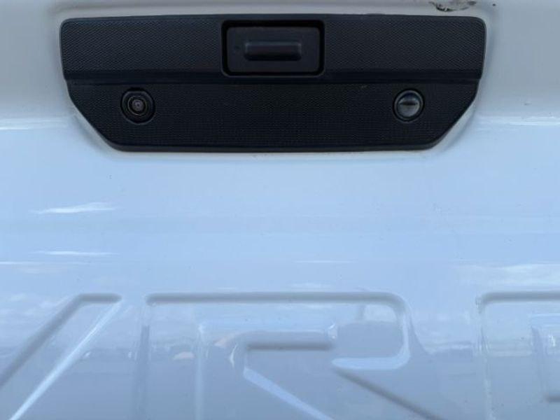 2021 Summit White /Jet Black Chevrolet Silverado Custom Trail Boss (3GCPYCEF3MG) with an V8, 5.3L engine, 6-speed automatic transmission, located at 1175 N Woodruff Ave, Idaho Falls, ID, 83401, 43.506901, -111.999657 - <b>Vehicle Details</b><br>Built for hard work, weekend adventures, and everything in between, this pre-owned 2021 Chevrolet Silverado 1500 Trail Boss Custom delivers the bold capability truck shoppers want. Equipped with 4WD and a powerful V8, 5.3L Gasoline engine, this Chevrolet Silverado is ready- Photo#4