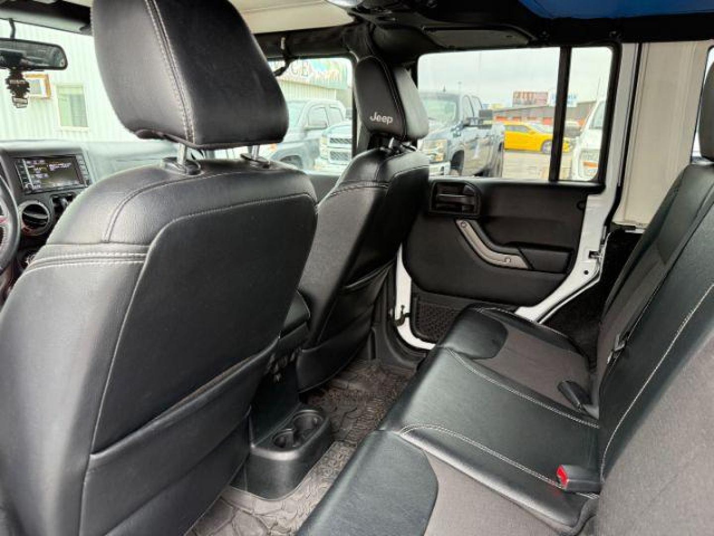 2018 WHITE /Black Jeep Wrangler JK Unlimited Freedom Edition 4x4 (1C4BJWDG3JL) with an Pentastar 3.6L V-6 DOHC engine, AUTOMATIC transmission, located at 1235 N Woodruff Ave., Idaho Falls, 83401, (208) 523-1053, 43.507172, -112.000488 - At Timberline Auto, finding a great deal on your next vehicle is always easy! Our experienced sales staff's goal is to help find you the right vehicle at the right price! Our knowledgeable finance department has options for almost any credit score. We offer extended service contract options to prote - Photo#42