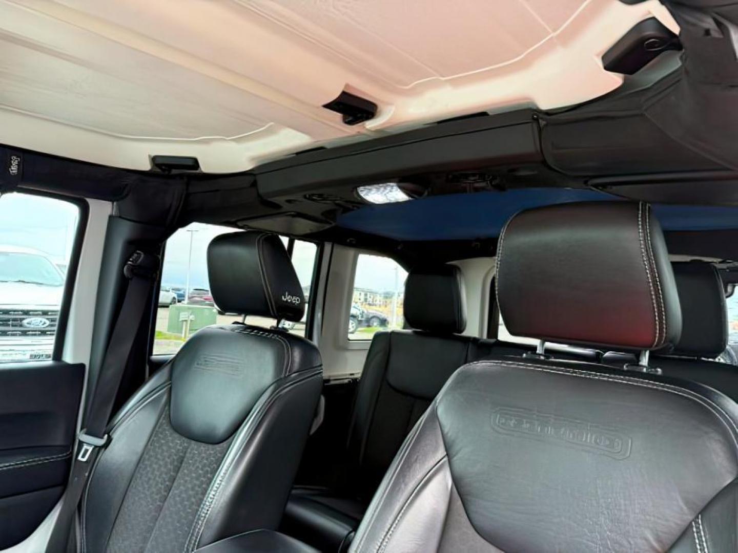 2018 WHITE /Black Jeep Wrangler JK Unlimited Freedom Edition 4x4 (1C4BJWDG3JL) with an Pentastar 3.6L V-6 DOHC engine, AUTOMATIC transmission, located at 1235 N Woodruff Ave., Idaho Falls, 83401, (208) 523-1053, 43.507172, -112.000488 - At Timberline Auto, finding a great deal on your next vehicle is always easy! Our experienced sales staff's goal is to help find you the right vehicle at the right price! Our knowledgeable finance department has options for almost any credit score. We offer extended service contract options to prote - Photo#17