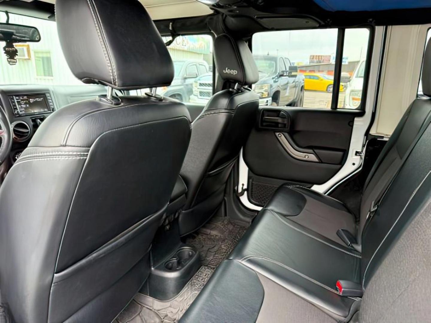 2018 WHITE /Black Jeep Wrangler JK Unlimited Freedom Edition 4x4 (1C4BJWDG3JL) with an Pentastar 3.6L V-6 DOHC engine, AUTOMATIC transmission, located at 1235 N Woodruff Ave., Idaho Falls, 83401, (208) 523-1053, 43.507172, -112.000488 - At Timberline Auto, finding a great deal on your next vehicle is always easy! Our experienced sales staff's goal is to help find you the right vehicle at the right price! Our knowledgeable finance department has options for almost any credit score. We offer extended service contract options to prote - Photo#20