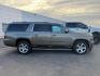 2016 BROWN /Cocoa/Dune Chevrolet Suburban LT (1GNSKHKC5GR) with an EcoTec3 5.3L V-8 gasoline direct injection engine, AUTOMATIC transmission, located at 1235 N Woodruff Ave., Idaho Falls, 83401, (208) 523-1053, 43.507172, -112.000488 - At Timberline Auto, finding a great deal on your next vehicle is always easy! Our experienced sales staff's goal is to help find you the right vehicle at the right price! Our knowledgeable finance department has options for almost any credit score. We offer extended service contract options to prote - Photo#1