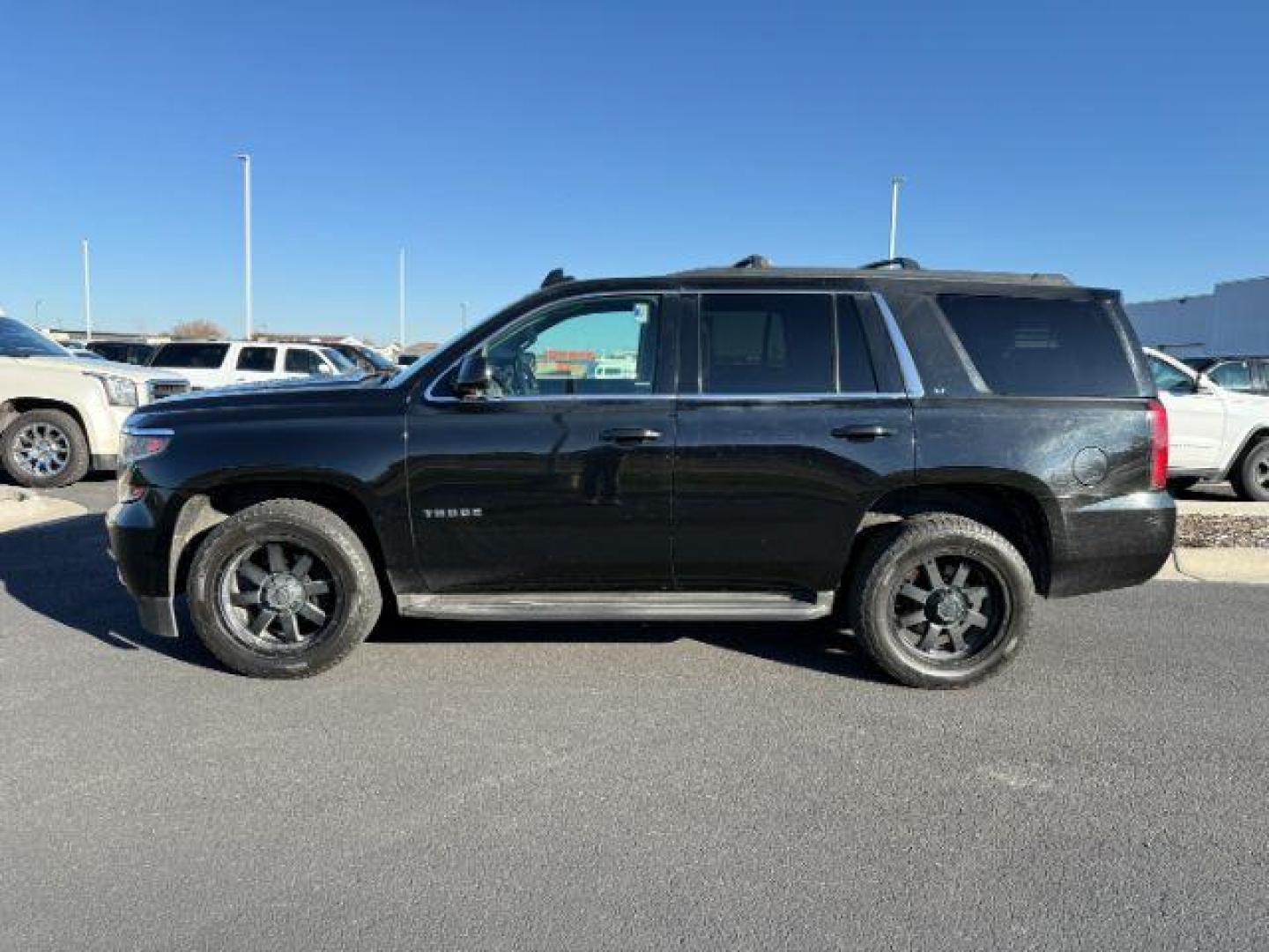 2015 Chevrolet Tahoe (1GNSKBKC3FR) with an EcoTec3 53L V-8 gasoline direct injection engine, located at 1175 N Woodruff Ave, Idaho Falls, ID, 83401, 43.506901, -111.999657 - ... Read the full description on our Website at: www.usedtrucksidahofalls.com - Photo#0