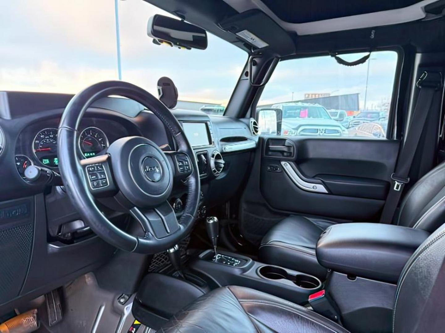 2016 Black Clearcoat /Black Jeep Wrangler Unlimited (1C4BJWFG8GL) with an Pentastar 36L V-6 DOHC engine, Automatic transmission, located at 1175 N Woodruff Ave, Idaho Falls, ID, 83401, 43.506901, -111.999657 - At Timberline Auto, finding a great deal on your next vehicle is always easy! Our experienced sales staff's goal is to help find you the right vehicle at the right price! Our knowledgeable finance department has options for almost any credit score. We offer extended service contract options to prote - Photo#12