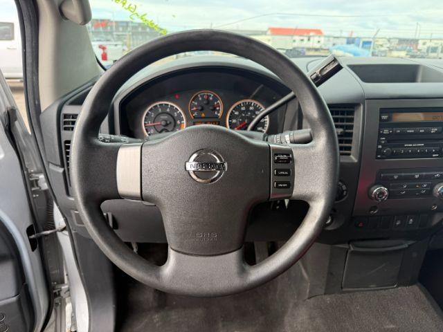 2012 SILVER /Charcoal Nissan Titan SV (1N6BA0EJ5CN) with an Endurance 5.6L V-8 DOHC engine, AUTOMATIC transmission, located at 1235 N Woodruff Ave., Idaho Falls, 83401, (208) 523-1053, 43.507172, -112.000488 - At Timberline Auto, finding a great deal on your next vehicle is always easy! Our experienced sales staff's goal is to help find you the right vehicle at the right price! Our knowledgeable finance department has options for almost any credit score. We offer extended service contract options to prote - Photo#32