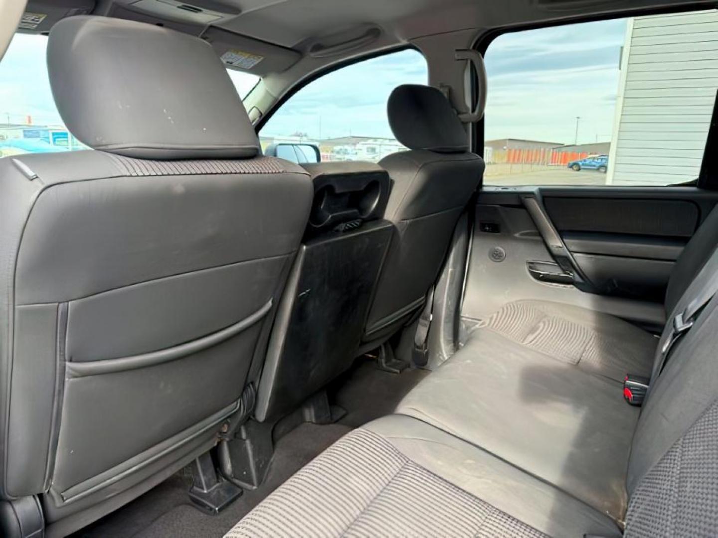 2012 SILVER /Charcoal Nissan Titan (1N6BA0EJ5CN) with an Endurance 56L V-8 DOHC engine, Automatic transmission, located at 1175 N Woodruff Ave, Idaho Falls, ID, 83401, 43.506901, -111.999657 - At Timberline Auto, finding a great deal on your next vehicle is always easy! Our experienced sales staff's goal is to help find you the right vehicle at the right price! Our knowledgeable finance department has options for almost any credit score. We offer extended service contract options to prote - Photo#18