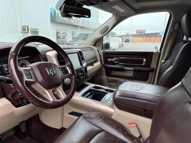 2017 Brilliant Black Crystal Pearl /LEATHER Ram 1500 Longhorn (1C6RR7PT4HS) with an V8, 5.7L engine, 8-speed automatic transmission, located at 1175 N Woodruff Ave, Idaho Falls, ID, 83401, 43.506901, -111.999657 - <b>Vehicle Details</b><br>Experience refined capability and premium comfort in this pre-owned 2017 Ram 1500 Laramie Longhorn, now available in Idaho Falls, ID. Powered by a proven V8, 5.7L gasoline engine and equipped with 4WD, this Ram 1500 delivers confident performance for towing, hauling, and ev- Photo#12