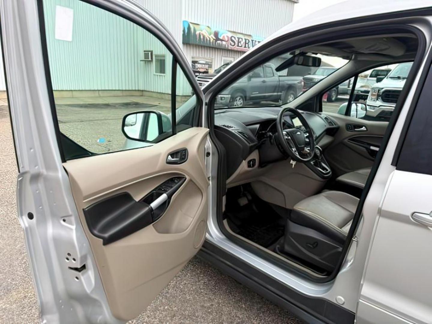 2014 SILVER /CLOTH Ford Transit Connect Wagon (NM0GE9G75E1) with an 25 I4 engine, Automatic transmission, located at 1175 N Woodruff Ave, Idaho Falls, ID, 83401, 43.506901, -111.999657 - At Timberline Auto, finding a great deal on your next vehicle is always easy! Our experienced sales staff's goal is to help find you the right vehicle at the right price! Our knowledgeable finance department has options for almost any credit score. We offer extended service contract options to prote - Photo#11