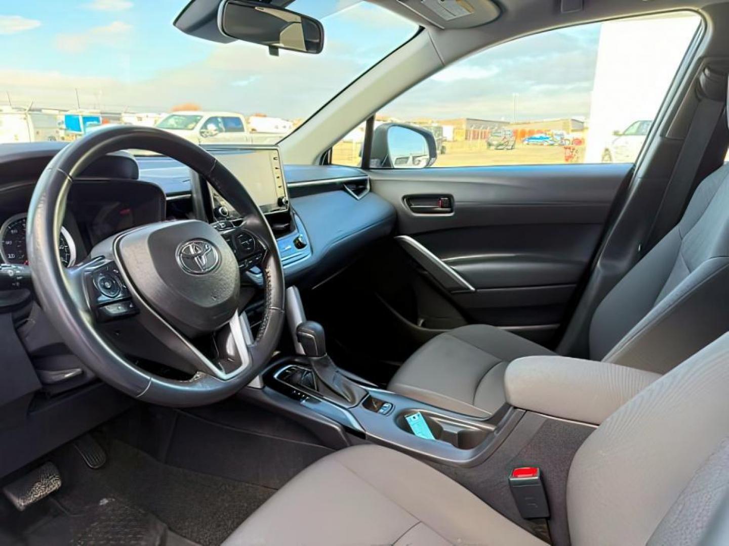 2022 Blue Crush Metallic /Black Toyota Corolla Cross (7MUBAABG0NV) with an Dynamic Force 2L I-4 portdirect injection engine, Automatic transmission, located at 1175 N Woodruff Ave, Idaho Falls, ID, 83401, 43.506901, -111.999657 - At Timberline Auto, finding a great deal on your next vehicle is always easy! Our experienced sales staff's goal is to help find you the right vehicle at the right price! Our knowledgeable finance department has options for almost any credit score. We offer extended service contract options to prote - Photo#14