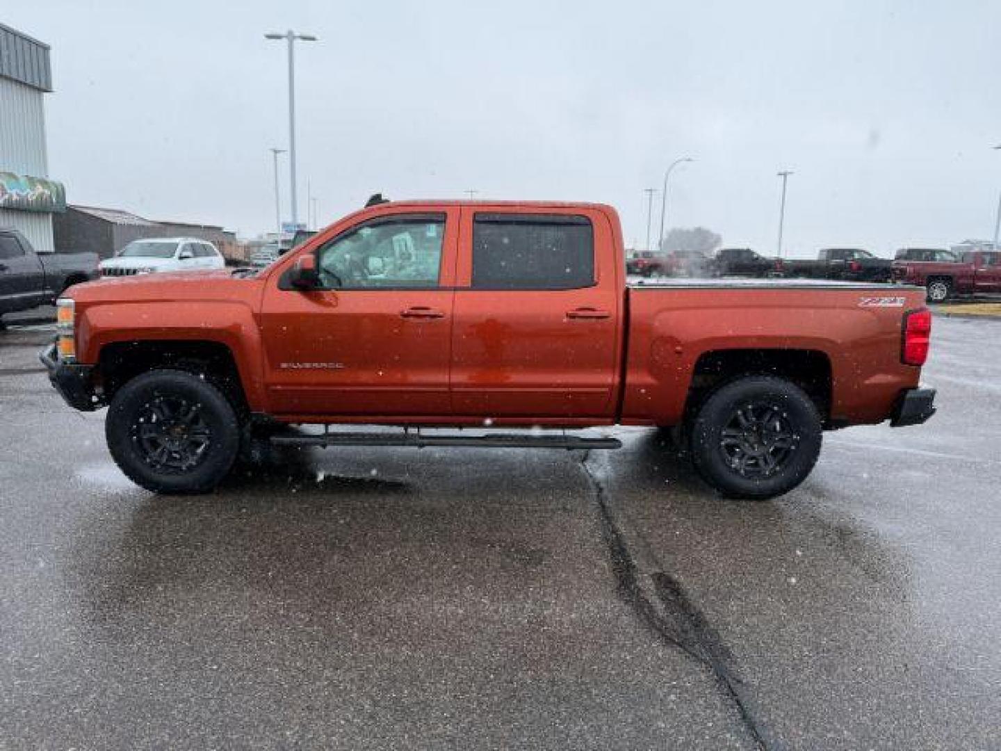 2015 ORANGE /CLOTH Chevrolet Silverado 1500 (3GCUKREC5FG) with an 53L V8 VORTEC engine, Automatic transmission, located at 1175 N Woodruff Ave, Idaho Falls, ID, 83401, 43.506901, -111.999657 - At Timberline Auto, finding a great deal on your next vehicle is always easy! Our experienced sales staff's goal is to help find you the right vehicle at the right price! Our knowledgeable finance department has options for almost any credit score. We offer extended service contract options to prote - Photo#1