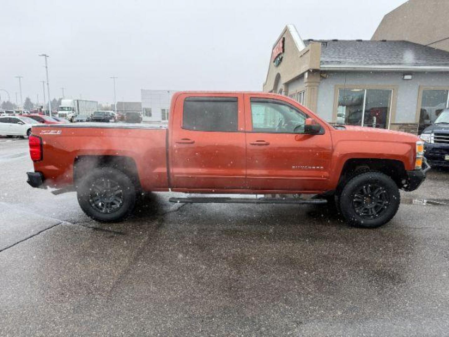 2015 ORANGE /CLOTH Chevrolet Silverado 1500 (3GCUKREC5FG) with an 53L V8 VORTEC engine, Automatic transmission, located at 1175 N Woodruff Ave, Idaho Falls, ID, 83401, 43.506901, -111.999657 - At Timberline Auto, finding a great deal on your next vehicle is always easy! Our experienced sales staff's goal is to help find you the right vehicle at the right price! Our knowledgeable finance department has options for almost any credit score. We offer extended service contract options to prote - Photo#7