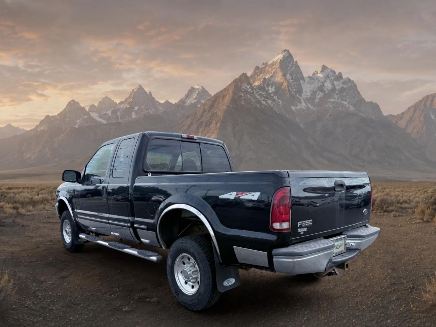 1999 Black Clearcoat /Medium Graphite Ford F-250 XLT (1FTNX21S8XE) with an V10, 6.8L (415 CID) engine, 4-speed automatic transmission, located at 1175 N Woodruff Ave, Idaho Falls, ID, 83401, 43.506901, -111.999657 - <b>Vehicle Details</b><br>Power, capability, and classic Ford toughness come together in this 1999 Ford F-250 Super Duty XLT 4WD, now available in Idaho Falls, ID. Built to handle hard work and weekend adventure alike, this heavy-duty pickup is powered by the legendary V10 6.8L (415 CID) gasoline en- Photo#2