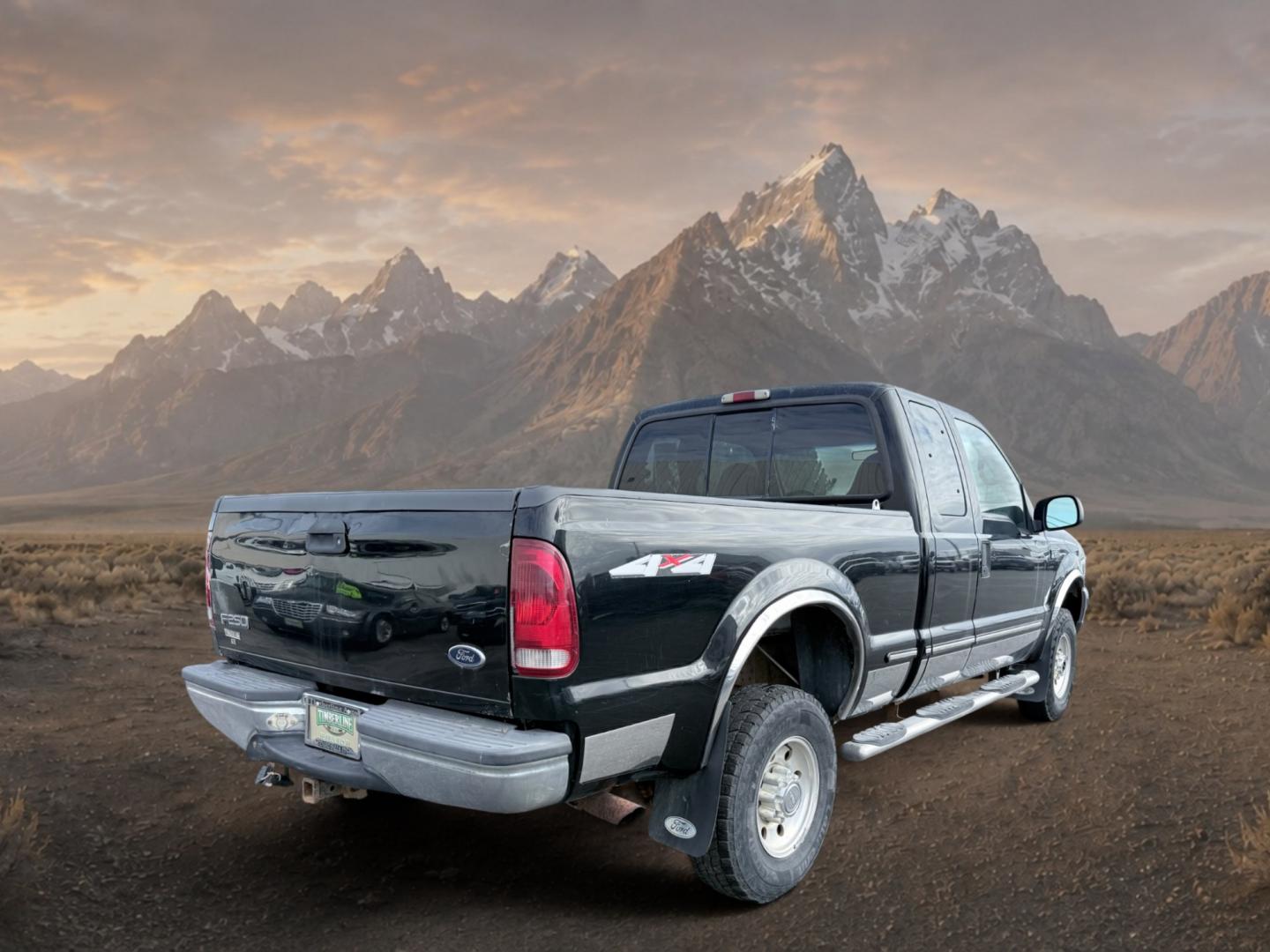 1999 Black Clearcoat /Medium Graphite Ford F-250 XLT (1FTNX21S8XE) with an V10, 6.8L (415 CID) engine, 4-speed automatic transmission, located at 1175 N Woodruff Ave, Idaho Falls, ID, 83401, 43.506901, -111.999657 - <b>Vehicle Details</b><br>Power, capability, and classic Ford toughness come together in this 1999 Ford F-250 Super Duty XLT 4WD, now available in Idaho Falls, ID. Built to handle hard work and weekend adventure alike, this heavy-duty pickup is powered by the legendary V10 6.8L (415 CID) gasoline en- Photo#4