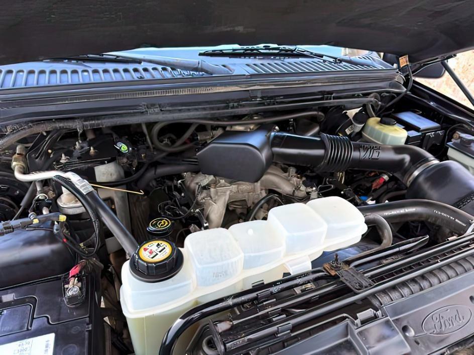 1999 Black Clearcoat /Medium Graphite Ford F-250 XLT (1FTNX21S8XE) with an V10, 6.8L (415 CID) engine, 4-speed automatic transmission, located at 1175 N Woodruff Ave, Idaho Falls, ID, 83401, 43.506901, -111.999657 - <b>Vehicle Details</b><br>Power, capability, and classic Ford toughness come together in this 1999 Ford F-250 Super Duty XLT 4WD, now available in Idaho Falls, ID. Built to handle hard work and weekend adventure alike, this heavy-duty pickup is powered by the legendary V10 6.8L (415 CID) gasoline en- Photo#41