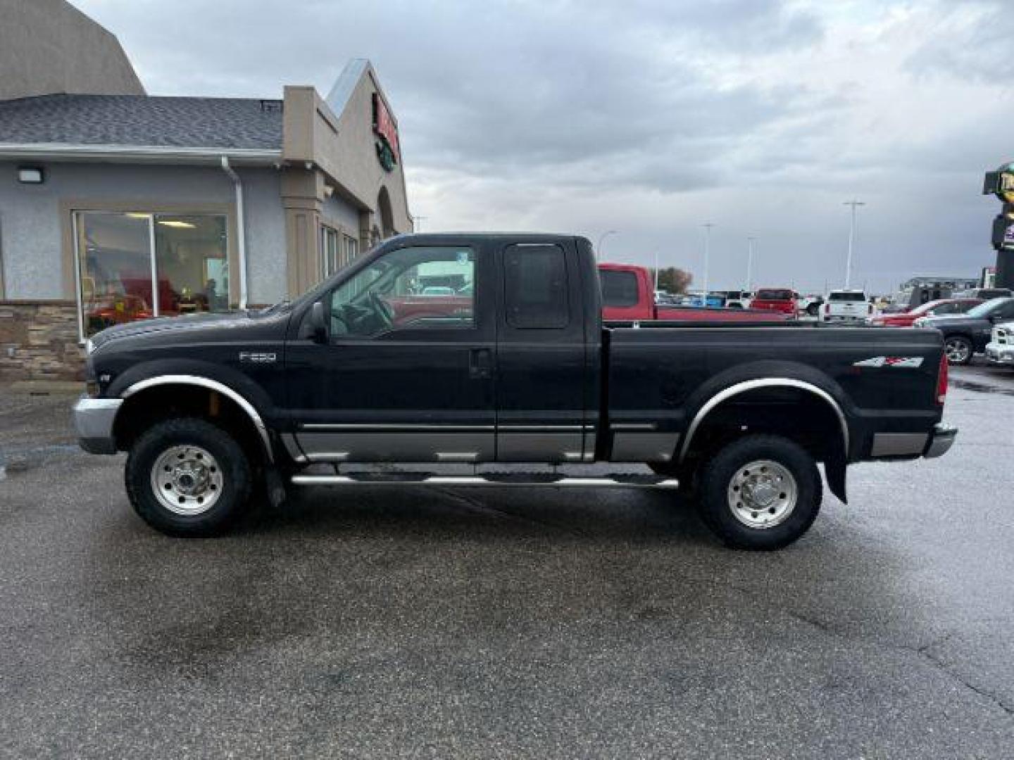 1999 BLACK /CLOTH Ford Super Duty F-250 (1FTNX21S8XE) with an 68L V10 engine, Manual transmission, located at 1175 N Woodruff Ave, Idaho Falls, ID, 83401, 43.506901, -111.999657 - At Timberline Auto, finding a great deal on your next vehicle is always easy! Our experienced sales staff's goal is to help find you the right vehicle at the right price! Our knowledgeable finance department has options for almost any credit score. We offer extended service contract options to prote - Photo#1