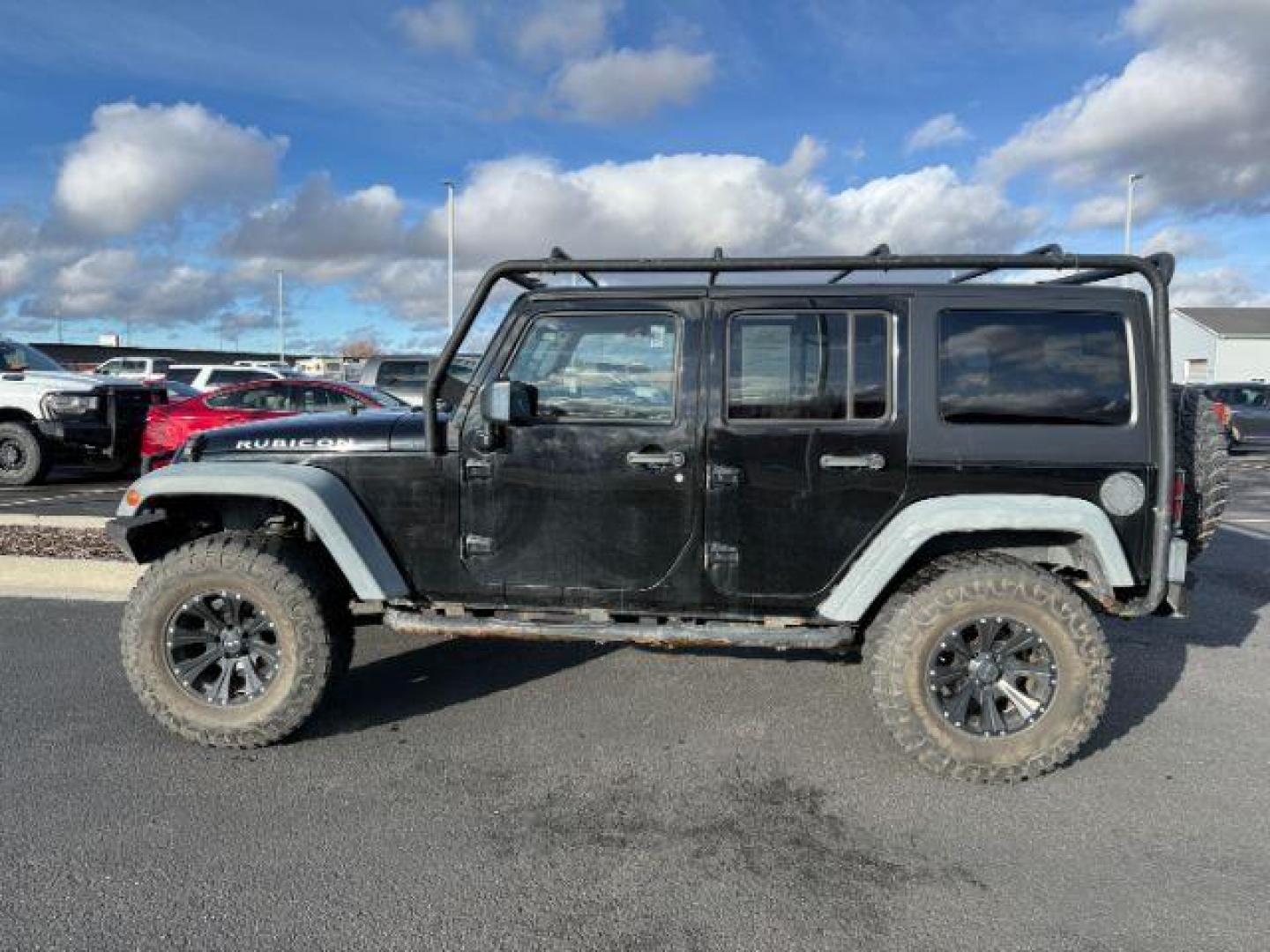 2011 Black Clearcoat /Black Jeep Wrangler Unlimited (1J4HA6H19BL) with an 38L V-6 regular unleaded engine, Automatic transmission, located at 1175 N Woodruff Ave, Idaho Falls, ID, 83401, 43.506901, -111.999657 - At Timberline Auto, finding a great deal on your next vehicle is always easy! Our experienced sales staff's goal is to help find you the right vehicle at the right price! Our knowledgeable finance department has options for almost any credit score. We offer extended service contract options to prote - Photo#1