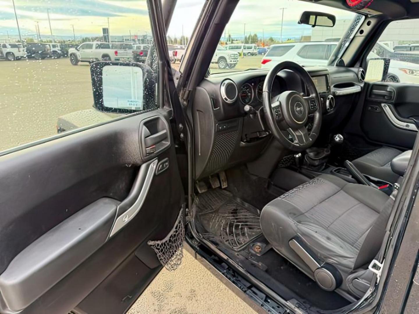 2011 Black Clearcoat /Black Jeep Wrangler Unlimited (1J4HA6H19BL) with an 38L V-6 regular unleaded engine, Automatic transmission, located at 1175 N Woodruff Ave, Idaho Falls, ID, 83401, 43.506901, -111.999657 - At Timberline Auto, finding a great deal on your next vehicle is always easy! Our experienced sales staff's goal is to help find you the right vehicle at the right price! Our knowledgeable finance department has options for almost any credit score. We offer extended service contract options to prote - Photo#12