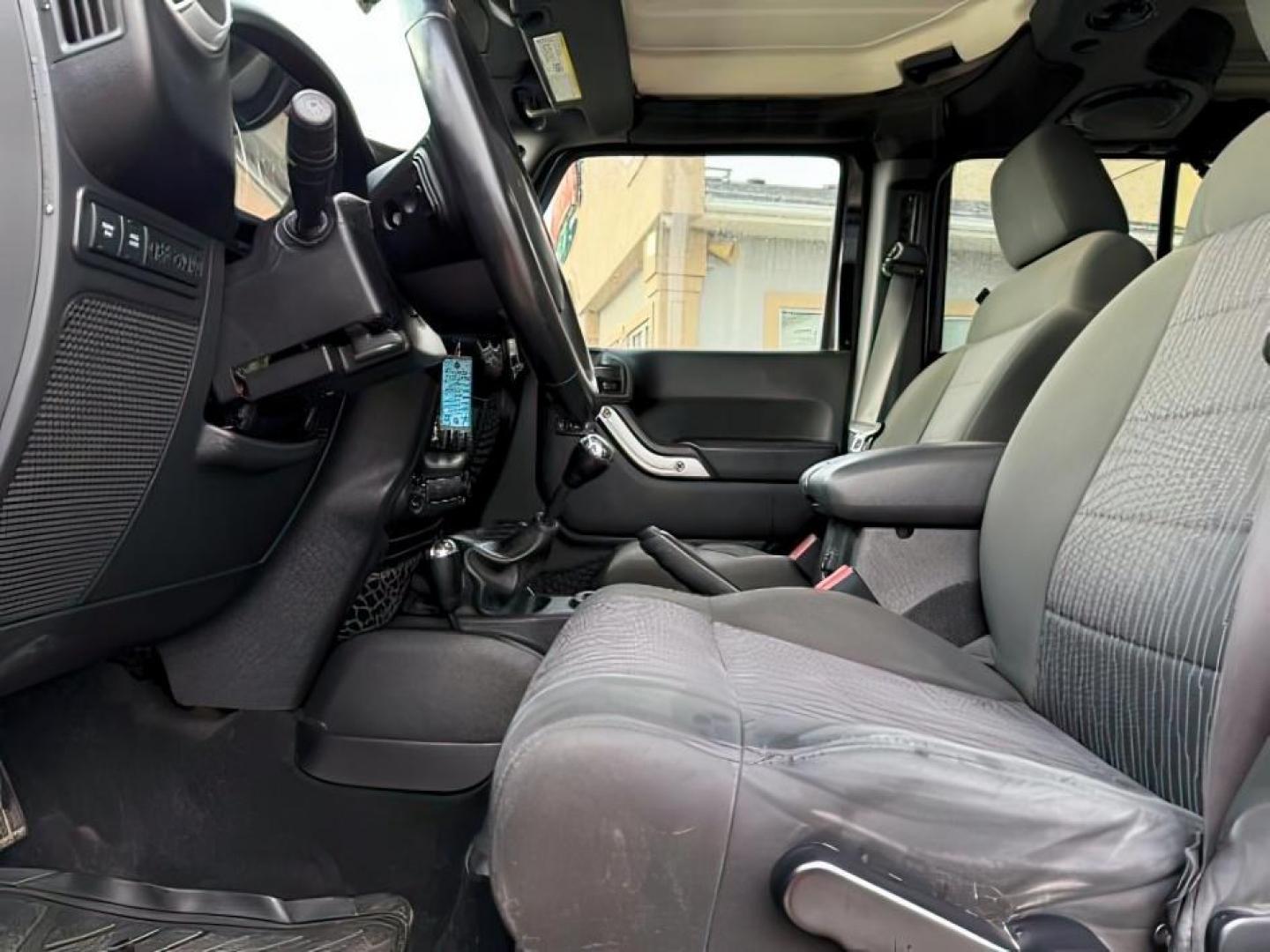 2011 Black Clearcoat /Black Jeep Wrangler Unlimited (1J4HA6H19BL) with an 38L V-6 regular unleaded engine, Automatic transmission, located at 1175 N Woodruff Ave, Idaho Falls, ID, 83401, 43.506901, -111.999657 - At Timberline Auto, finding a great deal on your next vehicle is always easy! Our experienced sales staff's goal is to help find you the right vehicle at the right price! Our knowledgeable finance department has options for almost any credit score. We offer extended service contract options to prote - Photo#13