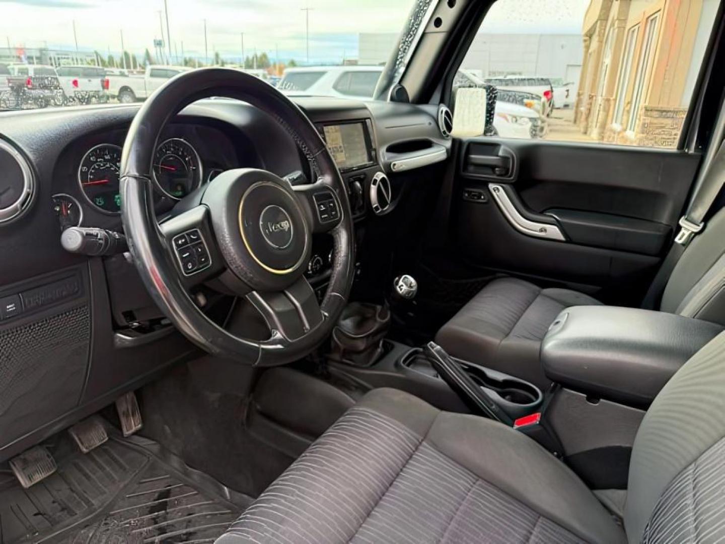 2011 Black Clearcoat /Black Jeep Wrangler Unlimited (1J4HA6H19BL) with an 38L V-6 regular unleaded engine, Automatic transmission, located at 1175 N Woodruff Ave, Idaho Falls, ID, 83401, 43.506901, -111.999657 - At Timberline Auto, finding a great deal on your next vehicle is always easy! Our experienced sales staff's goal is to help find you the right vehicle at the right price! Our knowledgeable finance department has options for almost any credit score. We offer extended service contract options to prote - Photo#14