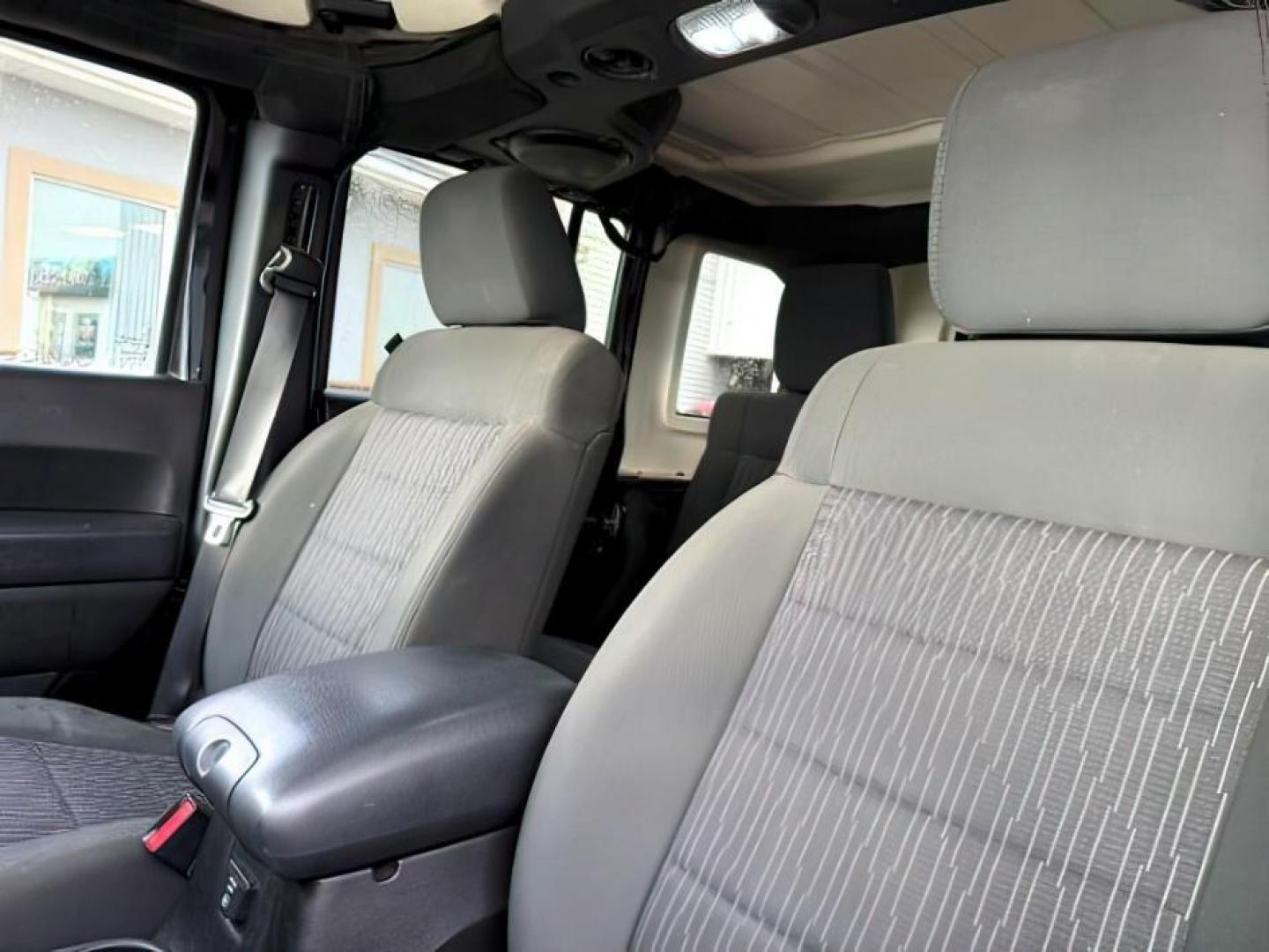 2011 Black Clearcoat /Black Jeep Wrangler Unlimited (1J4HA6H19BL) with an 38L V-6 regular unleaded engine, Automatic transmission, located at 1175 N Woodruff Ave, Idaho Falls, ID, 83401, 43.506901, -111.999657 - At Timberline Auto, finding a great deal on your next vehicle is always easy! Our experienced sales staff's goal is to help find you the right vehicle at the right price! Our knowledgeable finance department has options for almost any credit score. We offer extended service contract options to prote - Photo#18