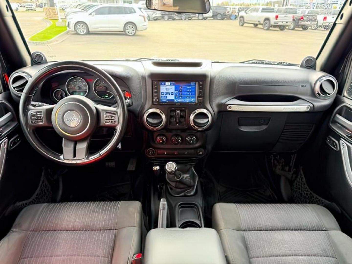 2011 Black Clearcoat /Black Jeep Wrangler Unlimited (1J4HA6H19BL) with an 38L V-6 regular unleaded engine, Automatic transmission, located at 1175 N Woodruff Ave, Idaho Falls, ID, 83401, 43.506901, -111.999657 - At Timberline Auto, finding a great deal on your next vehicle is always easy! Our experienced sales staff's goal is to help find you the right vehicle at the right price! Our knowledgeable finance department has options for almost any credit score. We offer extended service contract options to prote - Photo#20
