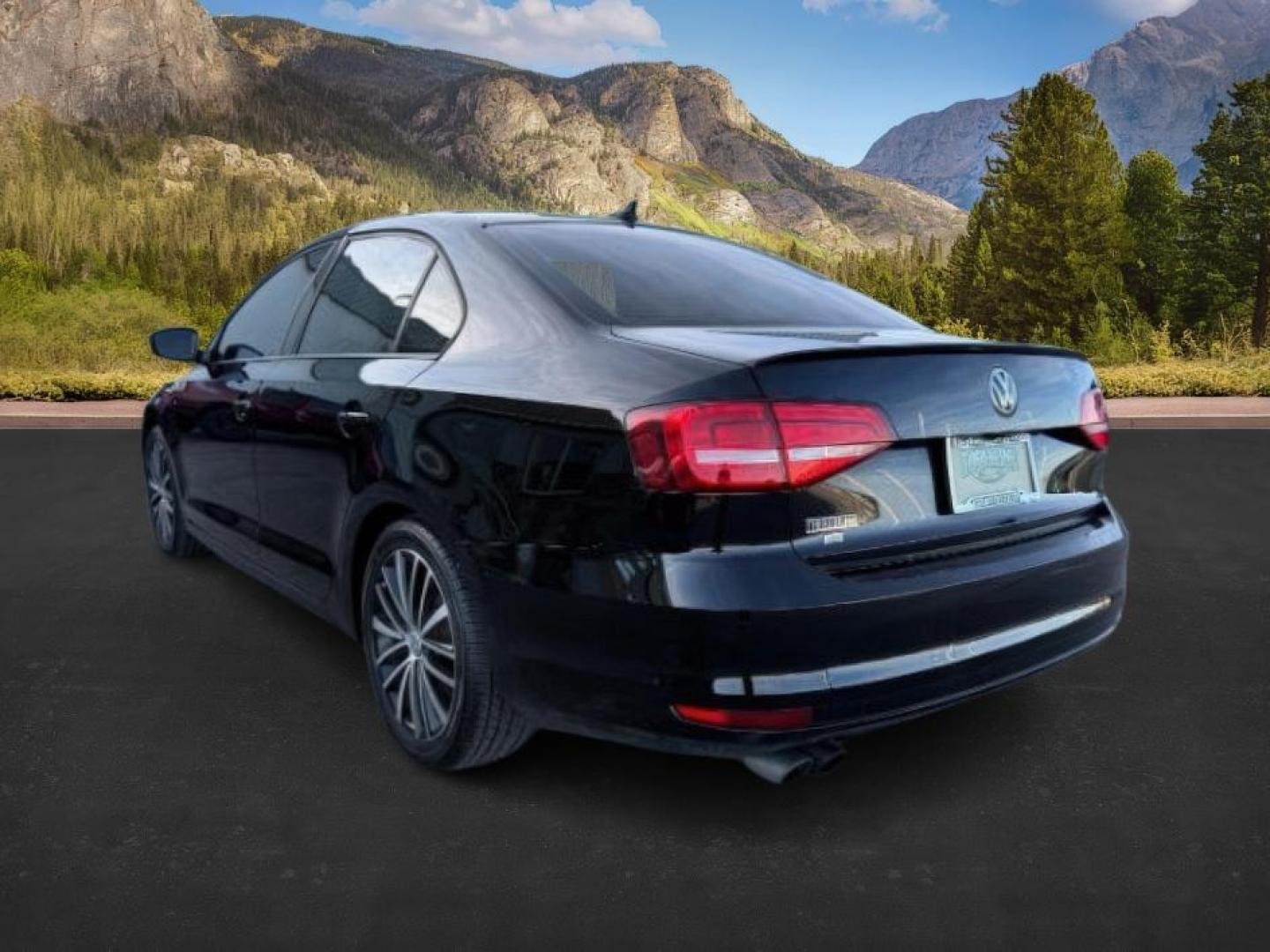 2015 Black Uni /Black Ceramique Volkswagen Jetta Sedan (3VWD17AJ3FM) with an 18L I-4 gasoline direct injection engine, Automatic transmission, located at 1175 N Woodruff Ave, Idaho Falls, ID, 83401, 43.506901, -111.999657 - At Timberline Auto, finding a great deal on your next vehicle is always easy! Our experienced sales staff's goal is to help find you the right vehicle at the right price! Our knowledgeable finance department has options for almost any credit score. We offer extended service contract options to prote - Photo#2