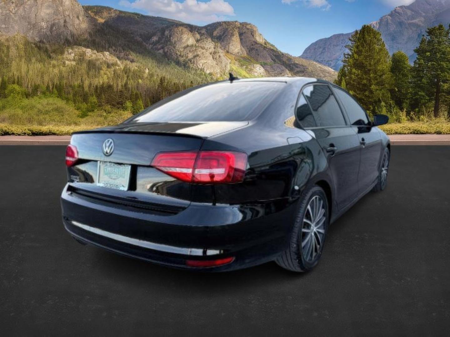 2015 Black Uni /Black Ceramique Volkswagen Jetta Sedan (3VWD17AJ3FM) with an 18L I-4 gasoline direct injection engine, Automatic transmission, located at 1175 N Woodruff Ave, Idaho Falls, ID, 83401, 43.506901, -111.999657 - At Timberline Auto, finding a great deal on your next vehicle is always easy! Our experienced sales staff's goal is to help find you the right vehicle at the right price! Our knowledgeable finance department has options for almost any credit score. We offer extended service contract options to prote - Photo#4