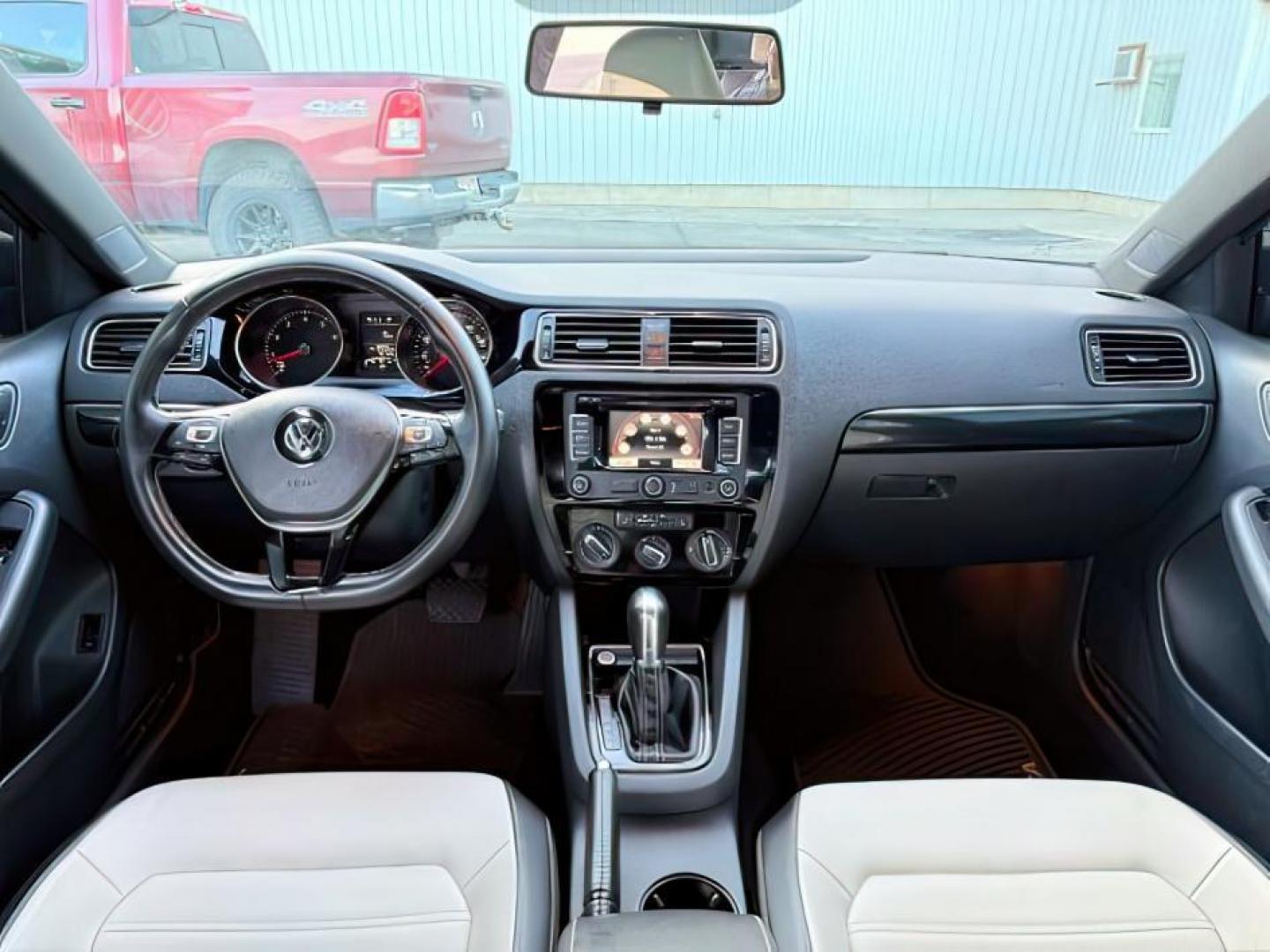 2015 Black Uni /Black Ceramique Volkswagen Jetta Sedan (3VWD17AJ3FM) with an 18L I-4 gasoline direct injection engine, Automatic transmission, located at 1175 N Woodruff Ave, Idaho Falls, ID, 83401, 43.506901, -111.999657 - At Timberline Auto, finding a great deal on your next vehicle is always easy! Our experienced sales staff's goal is to help find you the right vehicle at the right price! Our knowledgeable finance department has options for almost any credit score. We offer extended service contract options to prote - Photo#17