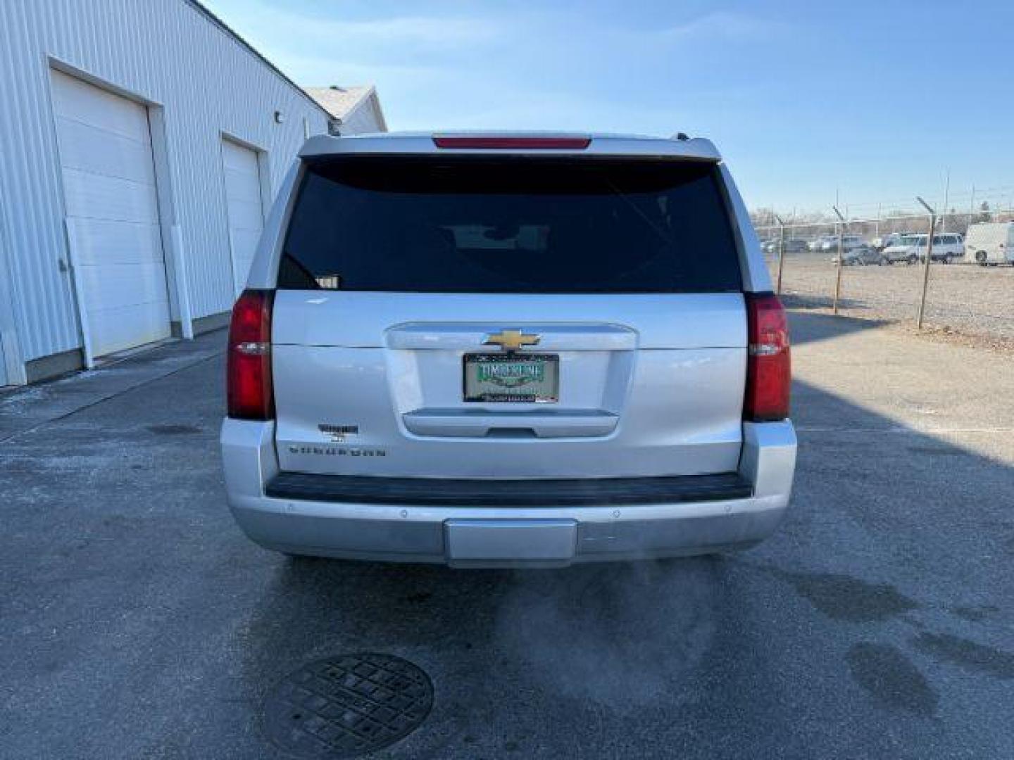 2015 SILVER /Jet Black Chevrolet Suburban 1500 (1GNSKJKC4FR) with an EcoTec3 53L V-8 gasoline direct injection engine, Automatic transmission, located at 1175 N Woodruff Ave, Idaho Falls, ID, 83401, 43.506901, -111.999657 - At Timberline Auto, finding a great deal on your next vehicle is always easy! Our experienced sales staff's goal is to help find you the right vehicle at the right price! Our knowledgeable finance department has options for almost any credit score. We offer extended service contract options to prote - Photo#3