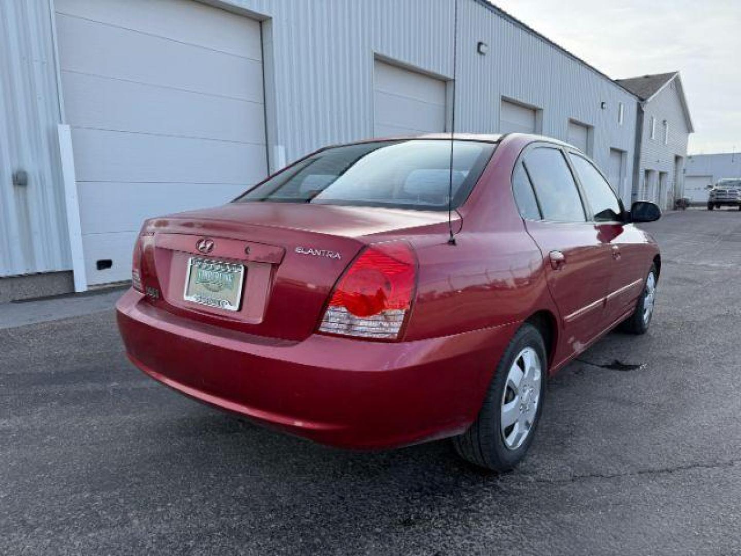 2004 RED /Gray Hyundai Elantra (KMHDN46D04U) with an 2L I-4 DOHC engine, Automatic transmission, located at 1175 N Woodruff Ave, Idaho Falls, ID, 83401, 43.506901, -111.999657 - At Timberline Auto, finding a great deal on your next vehicle is always easy! Our experienced sales staff's goal is to help find you the right vehicle at the right price! Our knowledgeable finance department has options for almost any credit score. We offer extended service contract options to prote - Photo#23