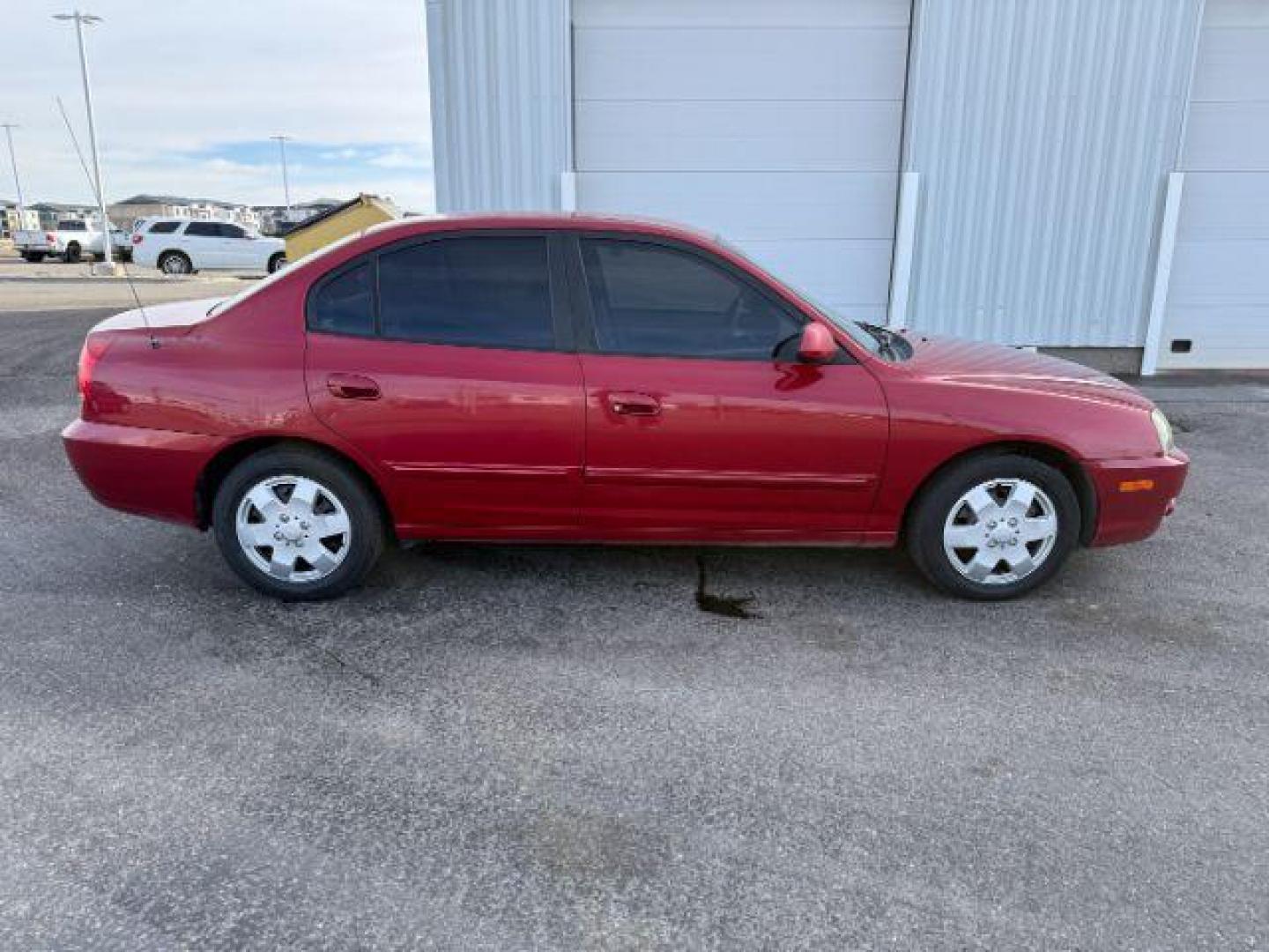 2004 RED /Gray Hyundai Elantra (KMHDN46D04U) with an 2L I-4 DOHC engine, Automatic transmission, located at 1175 N Woodruff Ave, Idaho Falls, ID, 83401, 43.506901, -111.999657 - At Timberline Auto, finding a great deal on your next vehicle is always easy! Our experienced sales staff's goal is to help find you the right vehicle at the right price! Our knowledgeable finance department has options for almost any credit score. We offer extended service contract options to prote - Photo#24
