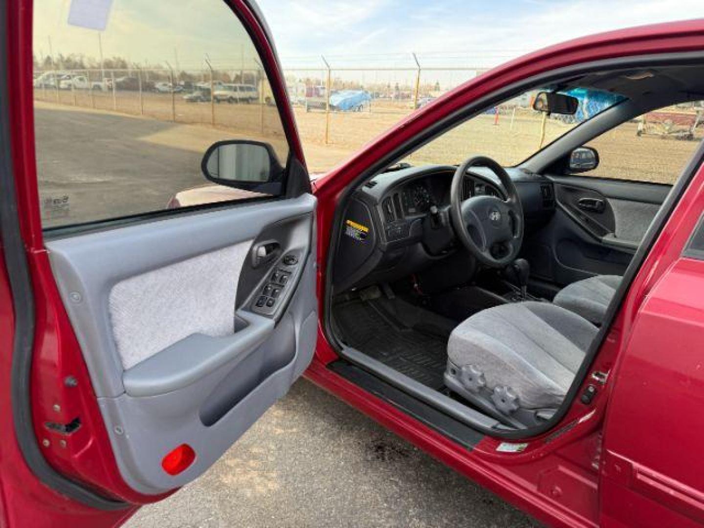 2004 RED /Gray Hyundai Elantra (KMHDN46D04U) with an 2L I-4 DOHC engine, Automatic transmission, located at 1175 N Woodruff Ave, Idaho Falls, ID, 83401, 43.506901, -111.999657 - At Timberline Auto, finding a great deal on your next vehicle is always easy! Our experienced sales staff's goal is to help find you the right vehicle at the right price! Our knowledgeable finance department has options for almost any credit score. We offer extended service contract options to prote - Photo#28
