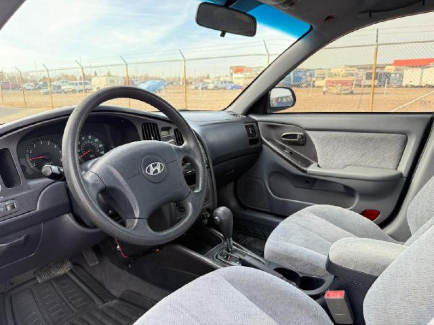 2004 RED /Gray Hyundai Elantra (KMHDN46D04U) with an 2L I-4 DOHC engine, Automatic transmission, located at 1175 N Woodruff Ave, Idaho Falls, ID, 83401, 43.506901, -111.999657 - At Timberline Auto, finding a great deal on your next vehicle is always easy! Our experienced sales staff's goal is to help find you the right vehicle at the right price! Our knowledgeable finance department has options for almost any credit score. We offer extended service contract options to prote - Photo#30