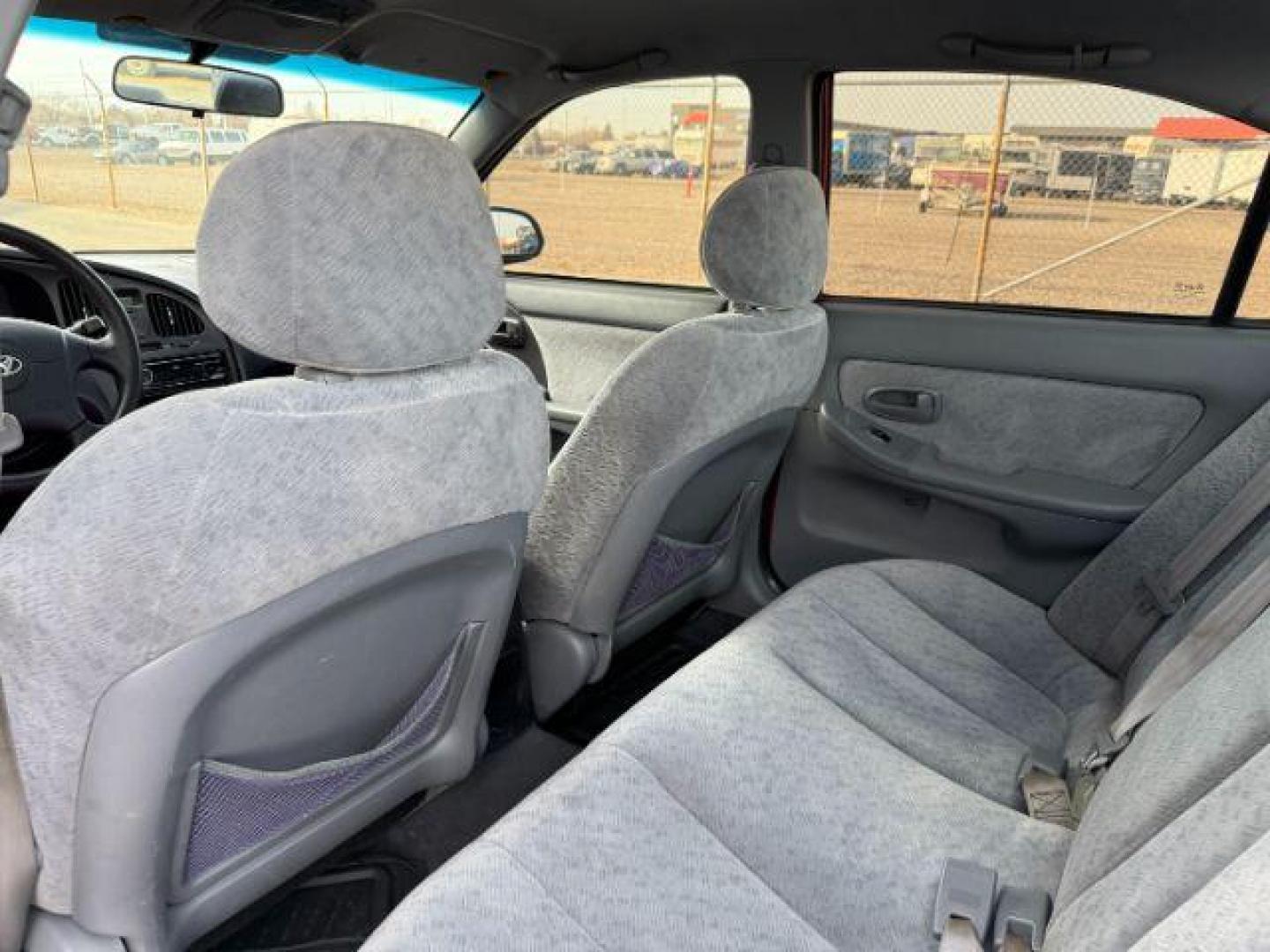 2004 RED /Gray Hyundai Elantra (KMHDN46D04U) with an 2L I-4 DOHC engine, Automatic transmission, located at 1175 N Woodruff Ave, Idaho Falls, ID, 83401, 43.506901, -111.999657 - At Timberline Auto, finding a great deal on your next vehicle is always easy! Our experienced sales staff's goal is to help find you the right vehicle at the right price! Our knowledgeable finance department has options for almost any credit score. We offer extended service contract options to prote - Photo#36