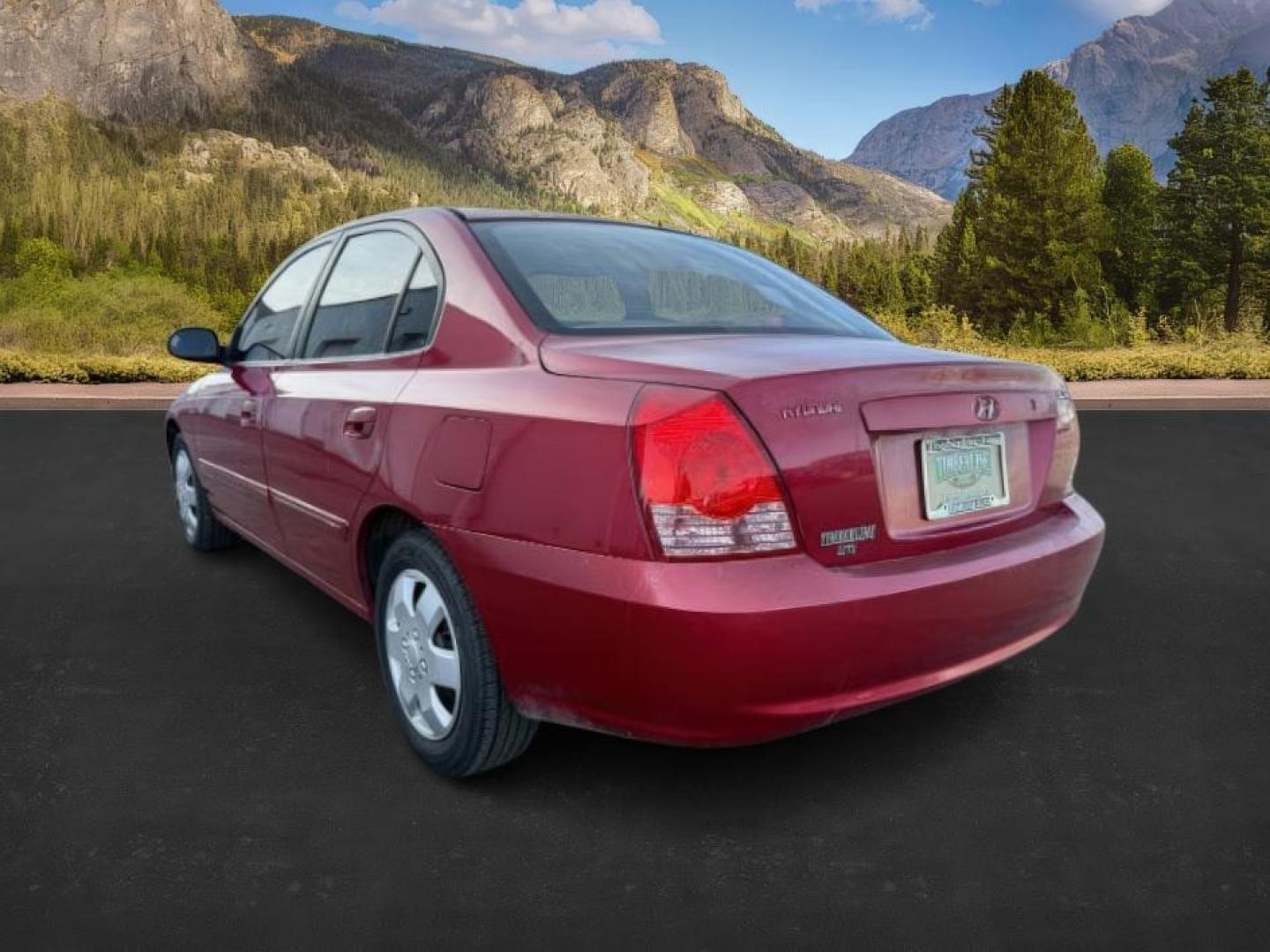 2004 RED /Gray Hyundai Elantra (KMHDN46D04U) with an 2L I-4 DOHC engine, Automatic transmission, located at 1175 N Woodruff Ave, Idaho Falls, ID, 83401, 43.506901, -111.999657 - At Timberline Auto, finding a great deal on your next vehicle is always easy! Our experienced sales staff's goal is to help find you the right vehicle at the right price! Our knowledgeable finance department has options for almost any credit score. We offer extended service contract options to prote - Photo#2