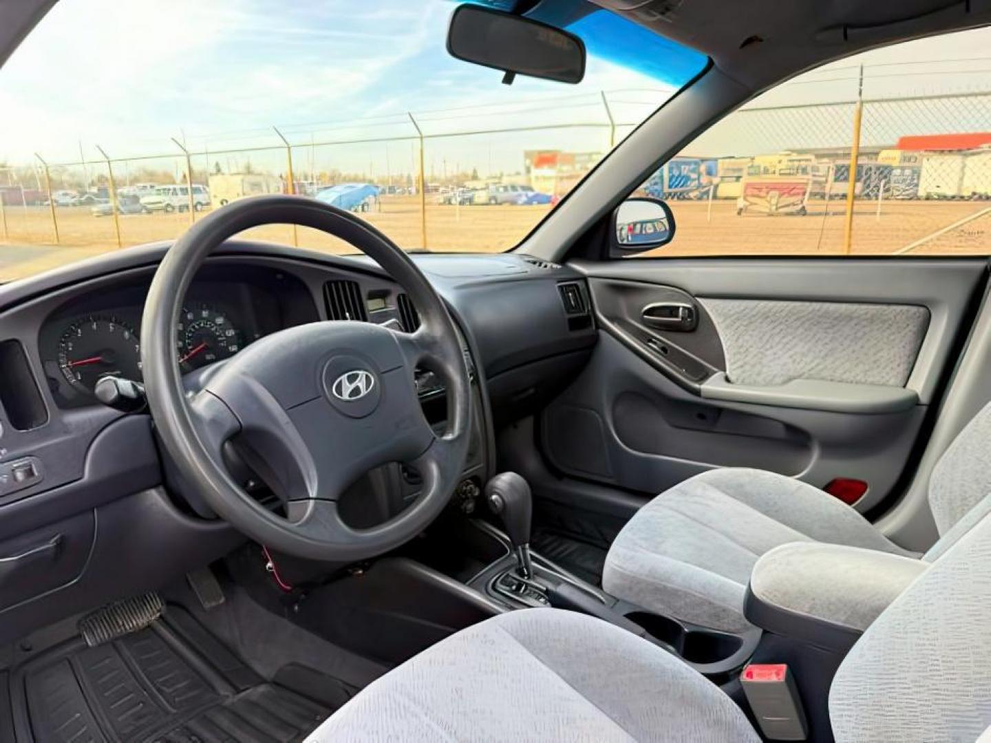 2004 RED /Gray Hyundai Elantra (KMHDN46D04U) with an 2L I-4 DOHC engine, Automatic transmission, located at 1175 N Woodruff Ave, Idaho Falls, ID, 83401, 43.506901, -111.999657 - At Timberline Auto, finding a great deal on your next vehicle is always easy! Our experienced sales staff's goal is to help find you the right vehicle at the right price! Our knowledgeable finance department has options for almost any credit score. We offer extended service contract options to prote - Photo#11