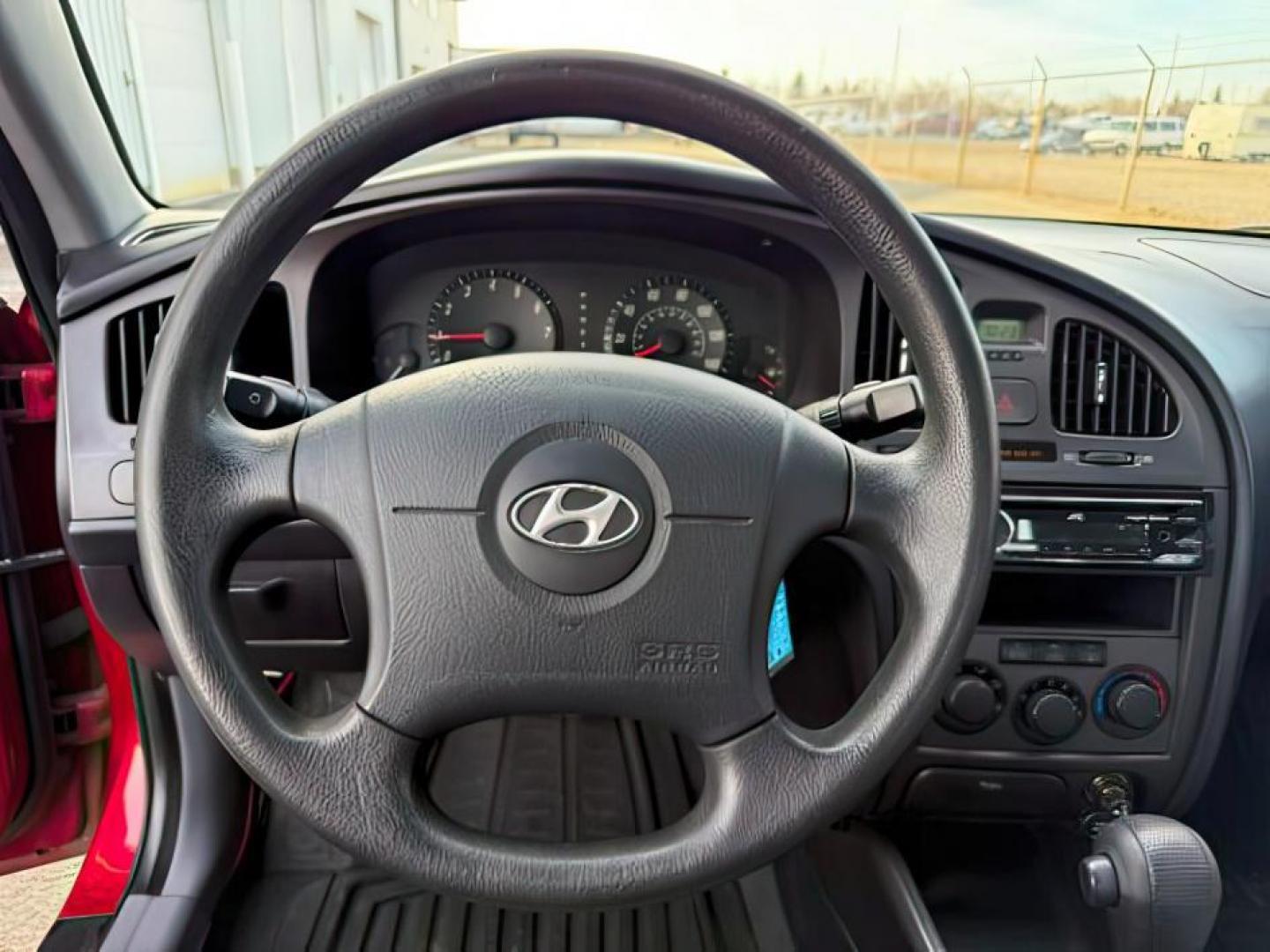 2004 RED /Gray Hyundai Elantra (KMHDN46D04U) with an 2L I-4 DOHC engine, Automatic transmission, located at 1175 N Woodruff Ave, Idaho Falls, ID, 83401, 43.506901, -111.999657 - At Timberline Auto, finding a great deal on your next vehicle is always easy! Our experienced sales staff's goal is to help find you the right vehicle at the right price! Our knowledgeable finance department has options for almost any credit score. We offer extended service contract options to prote - Photo#12