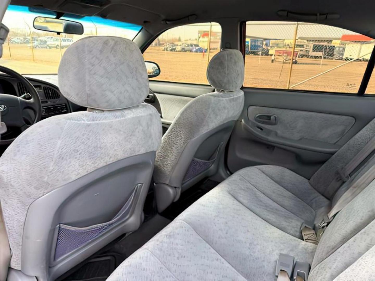 2004 RED /Gray Hyundai Elantra (KMHDN46D04U) with an 2L I-4 DOHC engine, Automatic transmission, located at 1175 N Woodruff Ave, Idaho Falls, ID, 83401, 43.506901, -111.999657 - At Timberline Auto, finding a great deal on your next vehicle is always easy! Our experienced sales staff's goal is to help find you the right vehicle at the right price! Our knowledgeable finance department has options for almost any credit score. We offer extended service contract options to prote - Photo#17