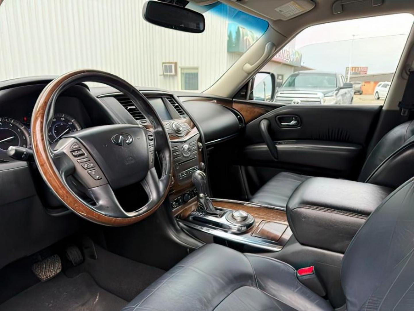 2013 BLACK /CLOTH Infiniti QX56 (JN8AZ2NEXD9) with an 56L V8 engine, Automatic transmission, located at 1175 N Woodruff Ave, Idaho Falls, ID, 83401, 43.506901, -111.999657 - Photo#16