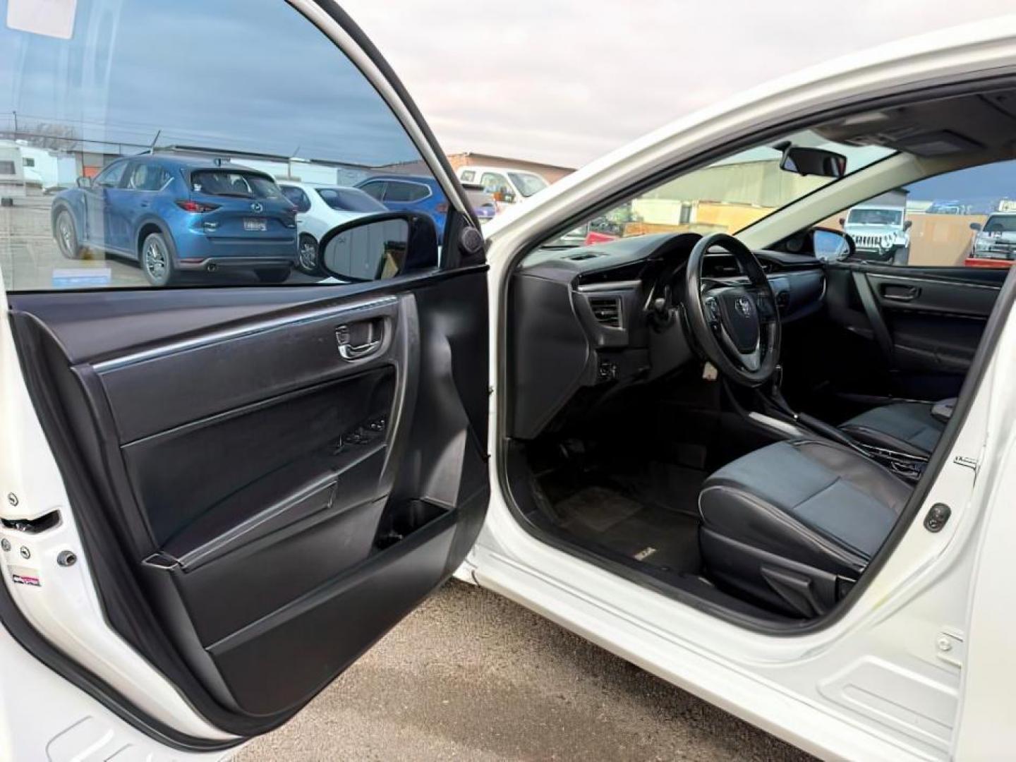 2014 Super White /Black Toyota Corolla (2T1BURHEXEC) with an 18L I-4 DOHC engine, Automatic transmission, located at 1175 N Woodruff Ave, Idaho Falls, ID, 83401, 43.506901, -111.999657 - At Timberline Auto, finding a great deal on your next vehicle is always easy! Our experienced sales staff's goal is to help find you the right vehicle at the right price! Our knowledgeable finance department has options for almost any credit score. We offer extended service contract options to prote - Photo#10